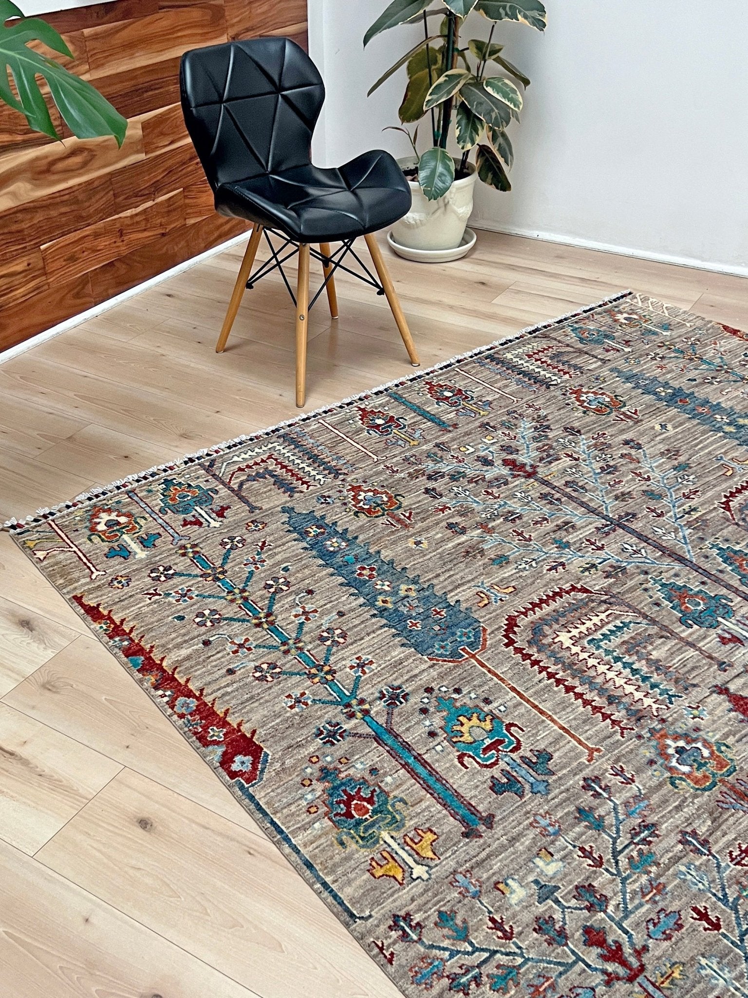 Side view of Tree of Life rug from the best luxury handmade rug shop in the San Francisco Bay Area. This exquisite piece features intricate patterns and vibrant colors, perfect for adding elegance to any space. Enjoy free shipping with your purchase.