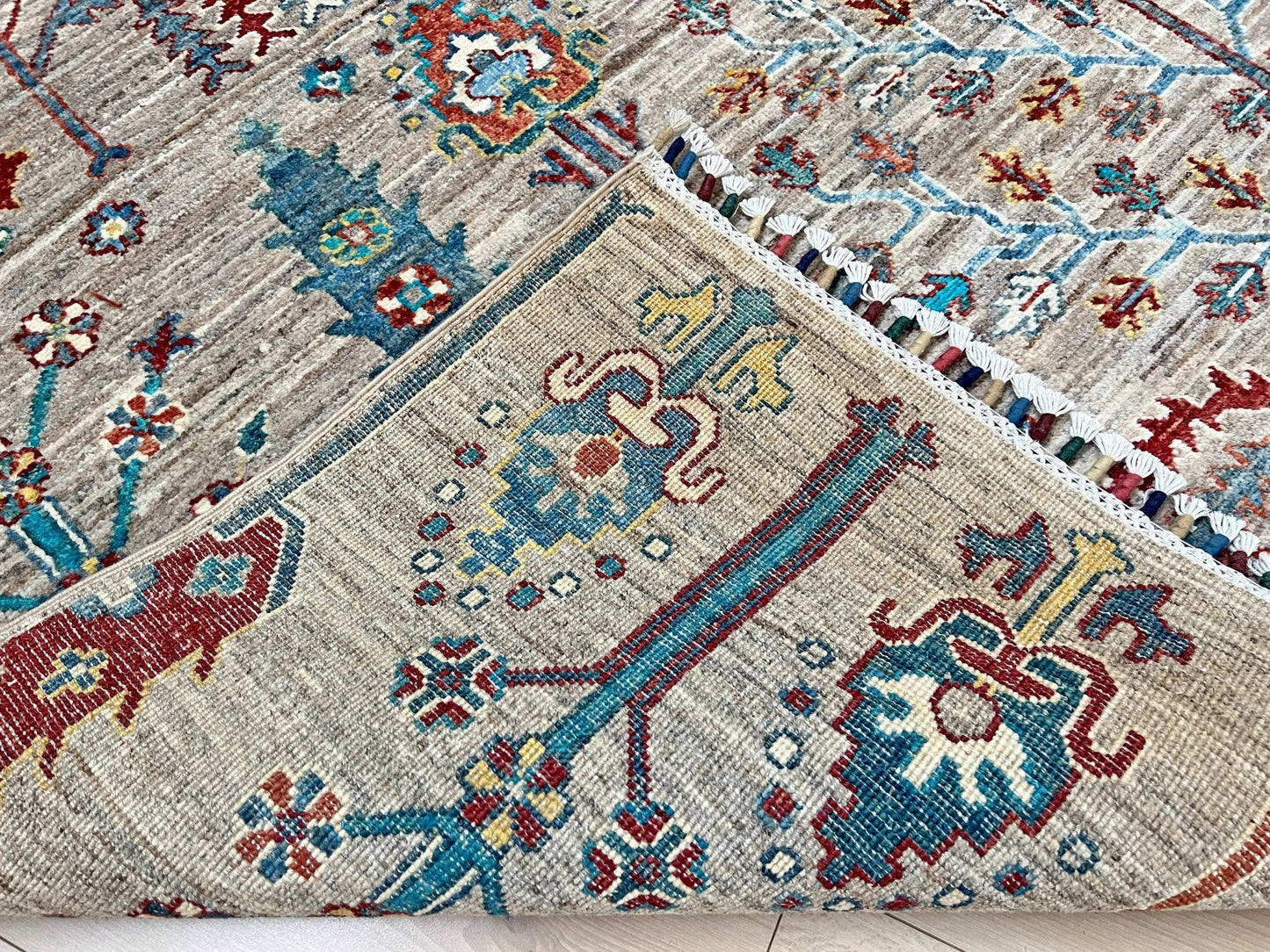 Back of Tree of Life rug from the best luxury handmade rug shop in the San Francisco Bay Area. This exquisite piece features intricate patterns and vibrant colors, perfect for adding elegance to any space. Enjoy free shipping with your purchase.