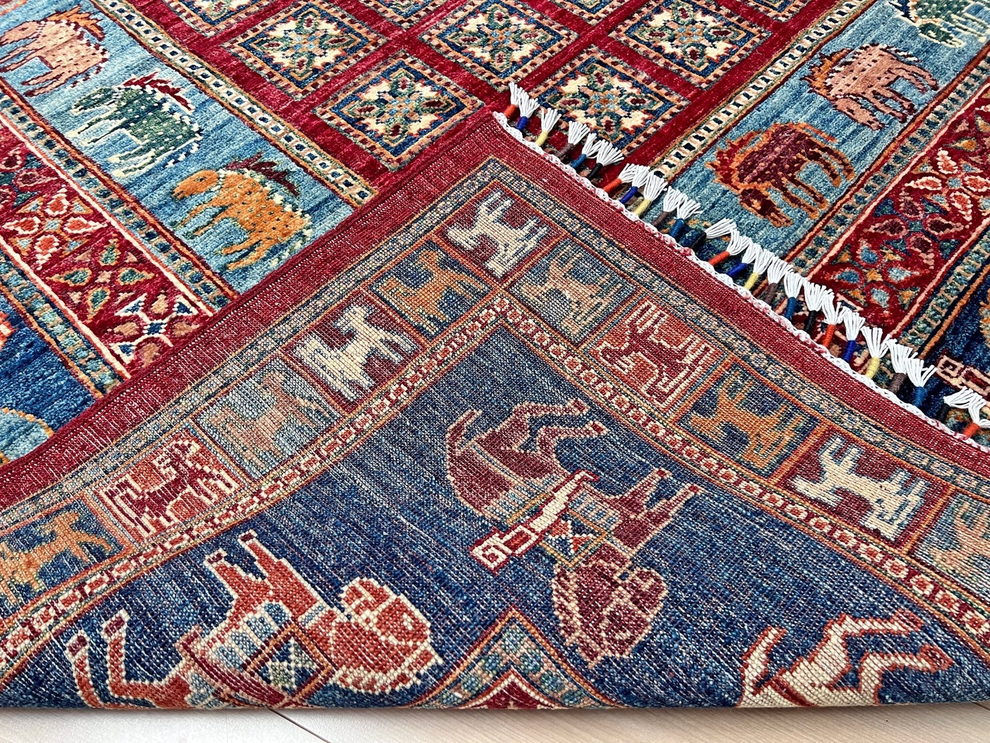 Luxury 6x9 handmade wool rug from Turkey, inspired by ancient Pazyryk motifs, featuring intricate grid patterns and stylized animals, perfect for living rooms, bedrooms, offices, and nurseries. Available at the Beds Rug Shop in the San Francisco Bay Area with free shipping.