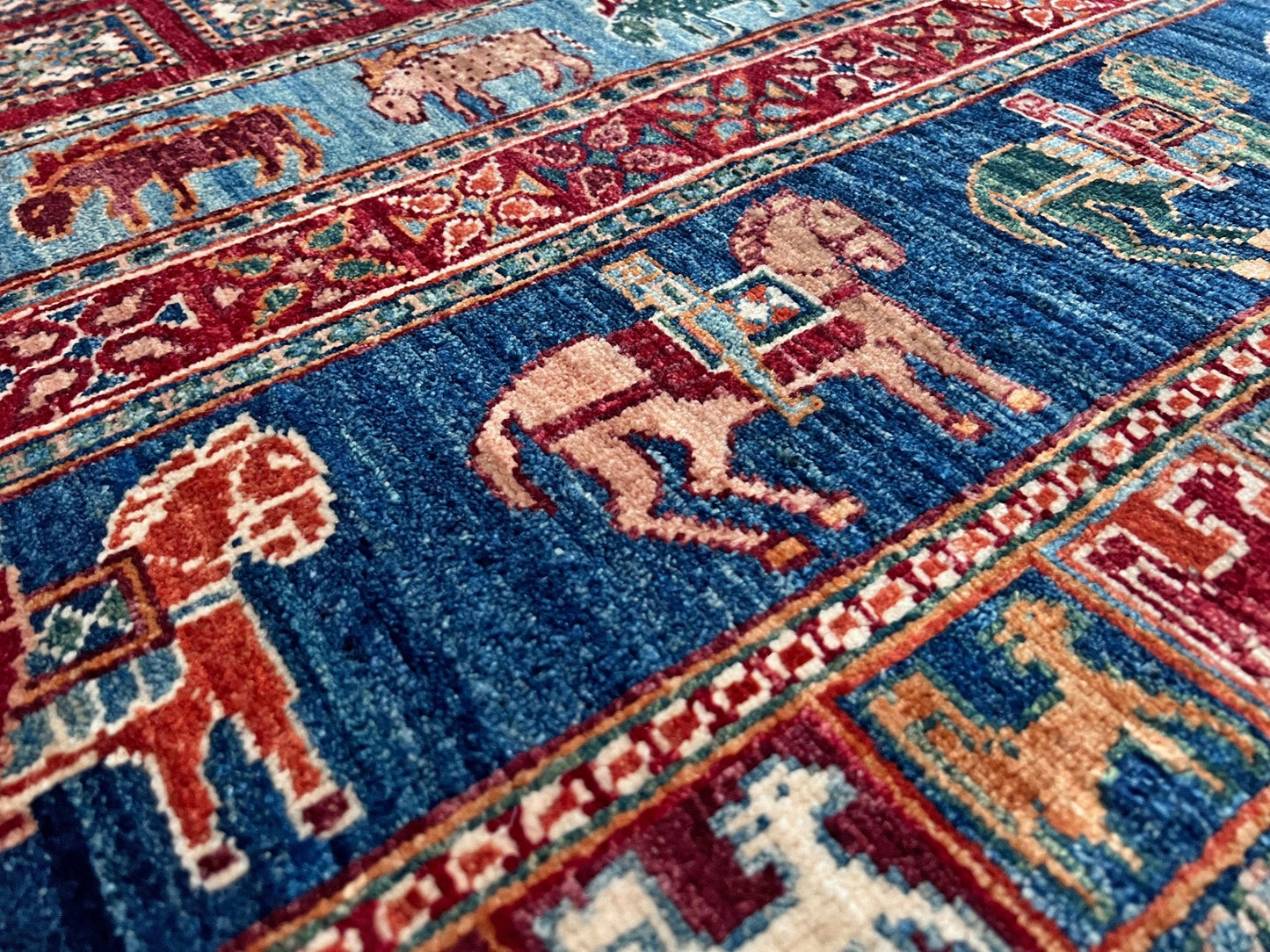 Luxury 6x9 handmade wool rug from Turkey, inspired by ancient Pazyryk motifs, featuring intricate grid patterns and stylized animals, perfect for living rooms, bedrooms, offices, and nurseries. Available at the Beds Rug Shop in the San Francisco Bay Area with free shipping.