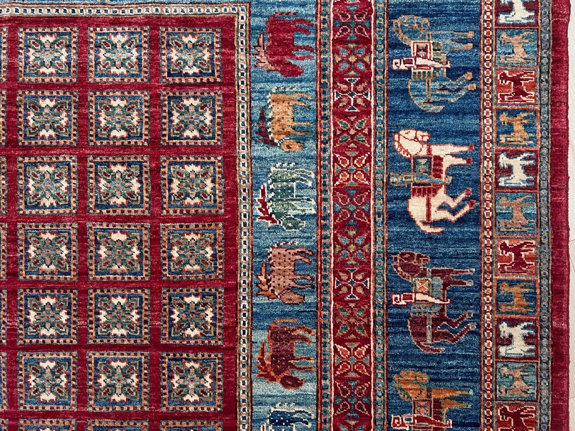 Luxury 6x9 handmade wool rug from Turkey, inspired by ancient Pazyryk motifs, featuring intricate grid patterns and stylized animals, perfect for living rooms, bedrooms, offices, and nurseries. Available at the Beds Rug Shop in the San Francisco Bay Area with free shipping.