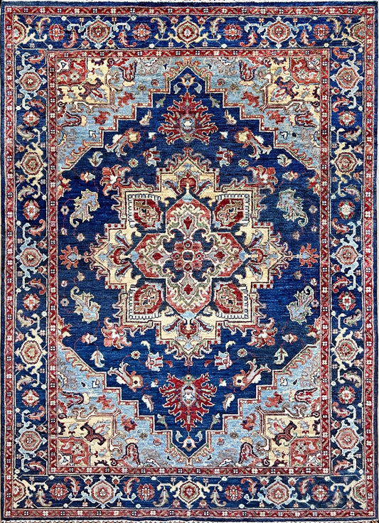 Heriz Persian rug in deep indigo, red, and cream with a bold geometric medallion, from the best luxury handmade rug shop in the San Francisco Bay Area. Perfect scatter rug or accent rug for living room, bedroom, kitchen, or nursery. Free shipping available for this exquisite handmade Persian rug.