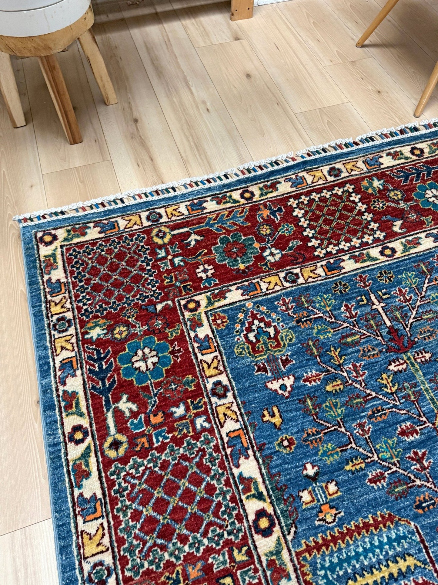 Brand new 9x12 Tree of Life Turkish rug – sky blue with deep crimson red, ivory, and gold accents. Perfect for bedroom, living room, or dining area. High-quality, handmade wool rug from the best rug shop in San Mateo, SF Bay Area. Free shipping available.