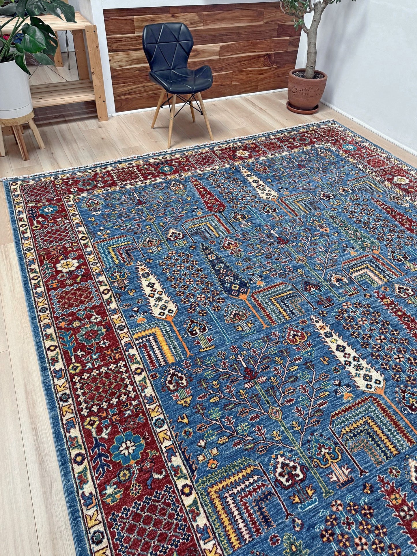 9x12 Tree of Life rug with sky blue field, deep crimson border, cypress trees, floral motifs, handmade wool from Indigo Rugs Burlingame Bay Area.