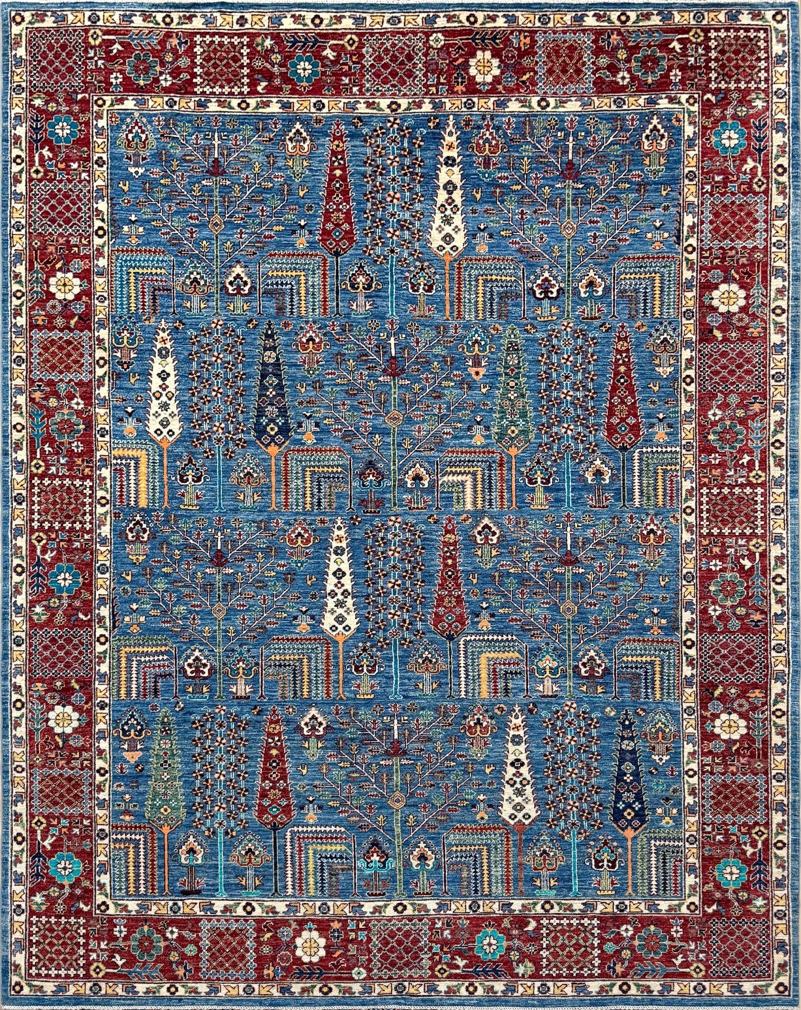 Brand new 9x12 Tree of Life Turkish rug – sky blue with deep crimson red, ivory, and gold accents. Perfect for bedroom, living room, or dining area. High-quality, handmade wool rug from the best rug shop in Burlingame CA, SF Bay Area. Free shipping available.