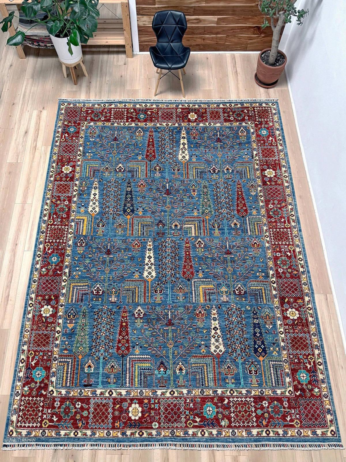 Blue Tree of Life 9x12 rug with sky blue field, deep crimson border, cypress trees, floral motifs, handmade wool from Indigo Rugs Burlingame Bay Area.
