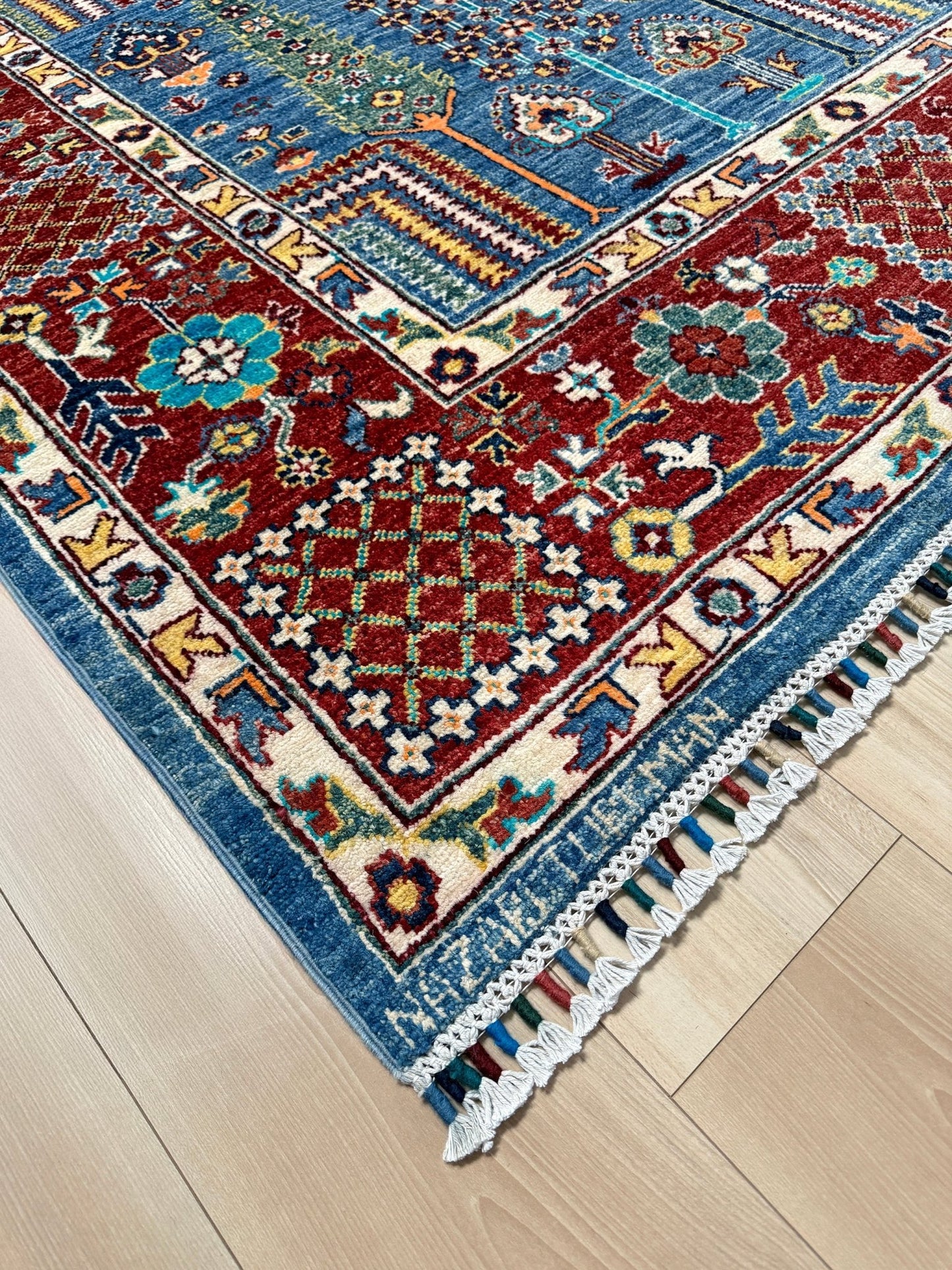 Brand new 9x12 Tree of Life Turkish rug – sky blue with deep crimson red, ivory, and gold accents. Perfect for bedroom, living room, or dining area. High-quality, handmade wool rug from the best rug shop in Burlingame CA, SF Bay Area. Free shipping available.
