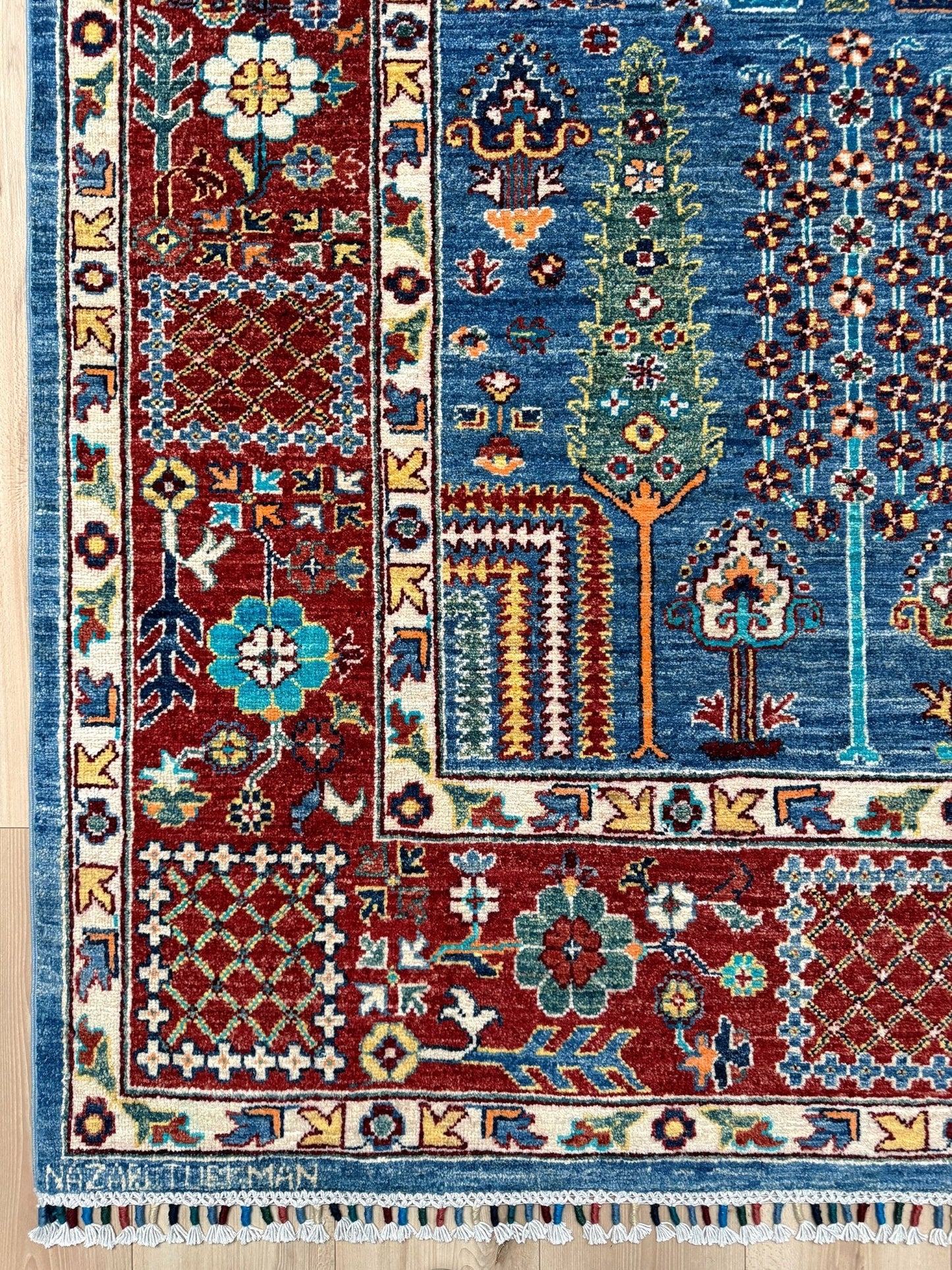 Brand new 9x12 Tree of Life Turkish rug – sky blue with deep crimson red, ivory, and gold accents. Perfect for bedroom, living room, or dining area. High-quality, handmade wool rug from the best rug shop in Burlingame CA, SF Bay Area. Free shipping available.