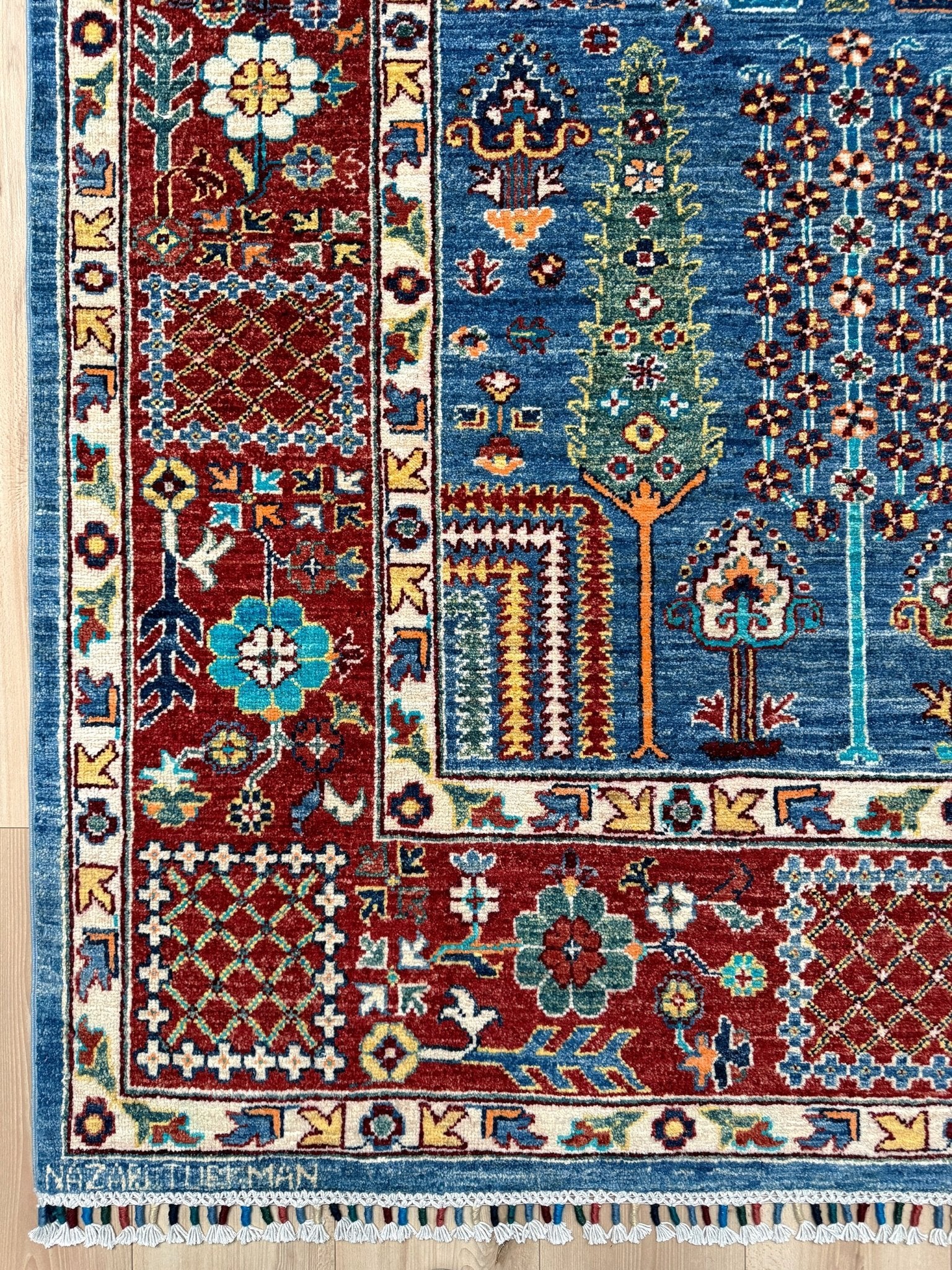 Brand new 9x12 Tree of Life Turkish rug – sky blue with deep crimson red, ivory, and gold accents. Perfect for bedroom, living room, or dining area. High-quality, handmade wool rug from the best rug shop in Burlingame CA, SF Bay Area. Free shipping available.