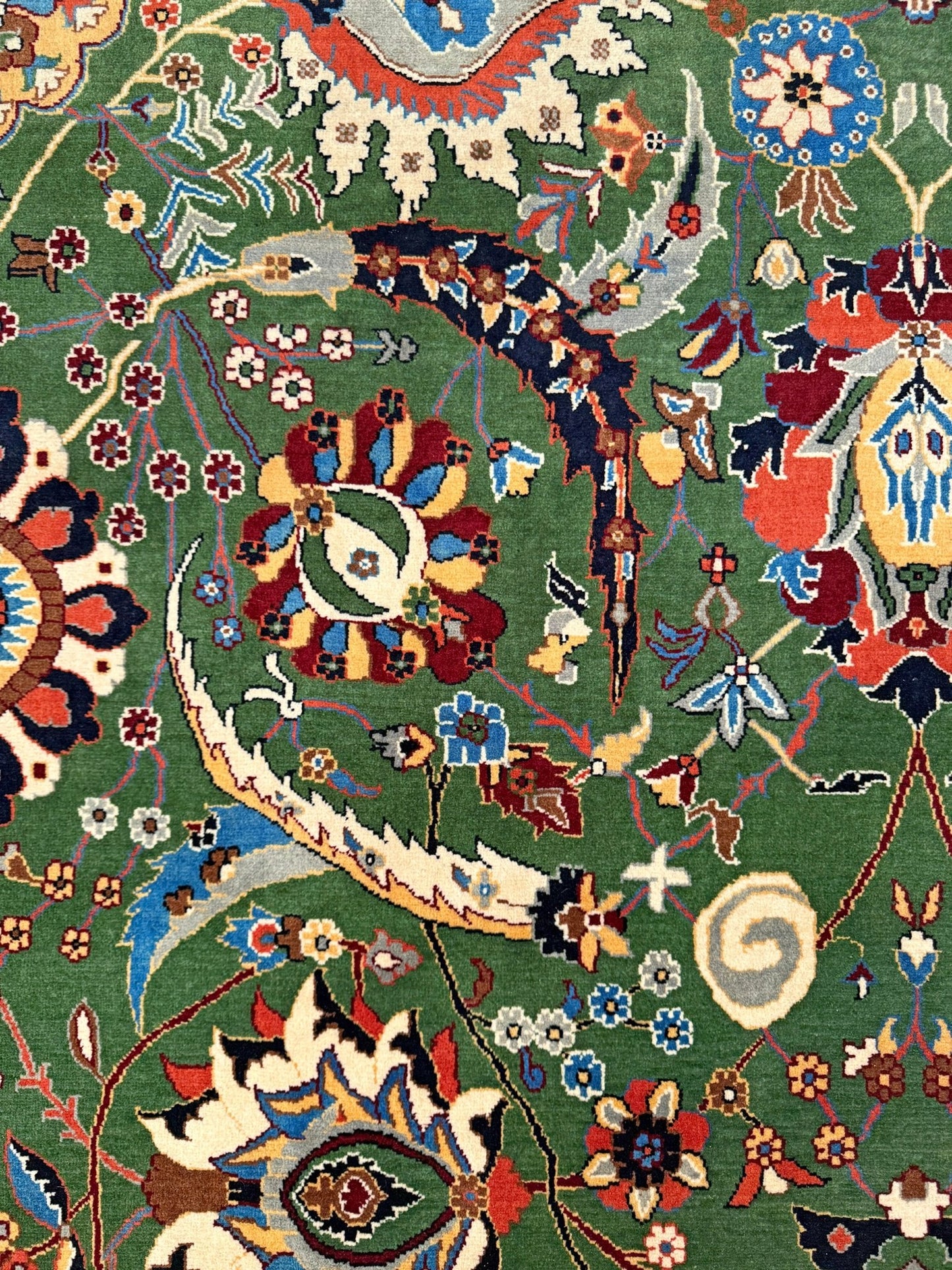 Brand new 9x12 Persian sickle leaf rug with verdant green, navy, and crimson hues, available at the best rug shop in San Mateo, SF Bay Area. Handwoven with intricate floral and vine patterns, perfect for a bedroom, living room, or dining space. High-quality wool rug with rich character and timeless elegance. Free shipping available.