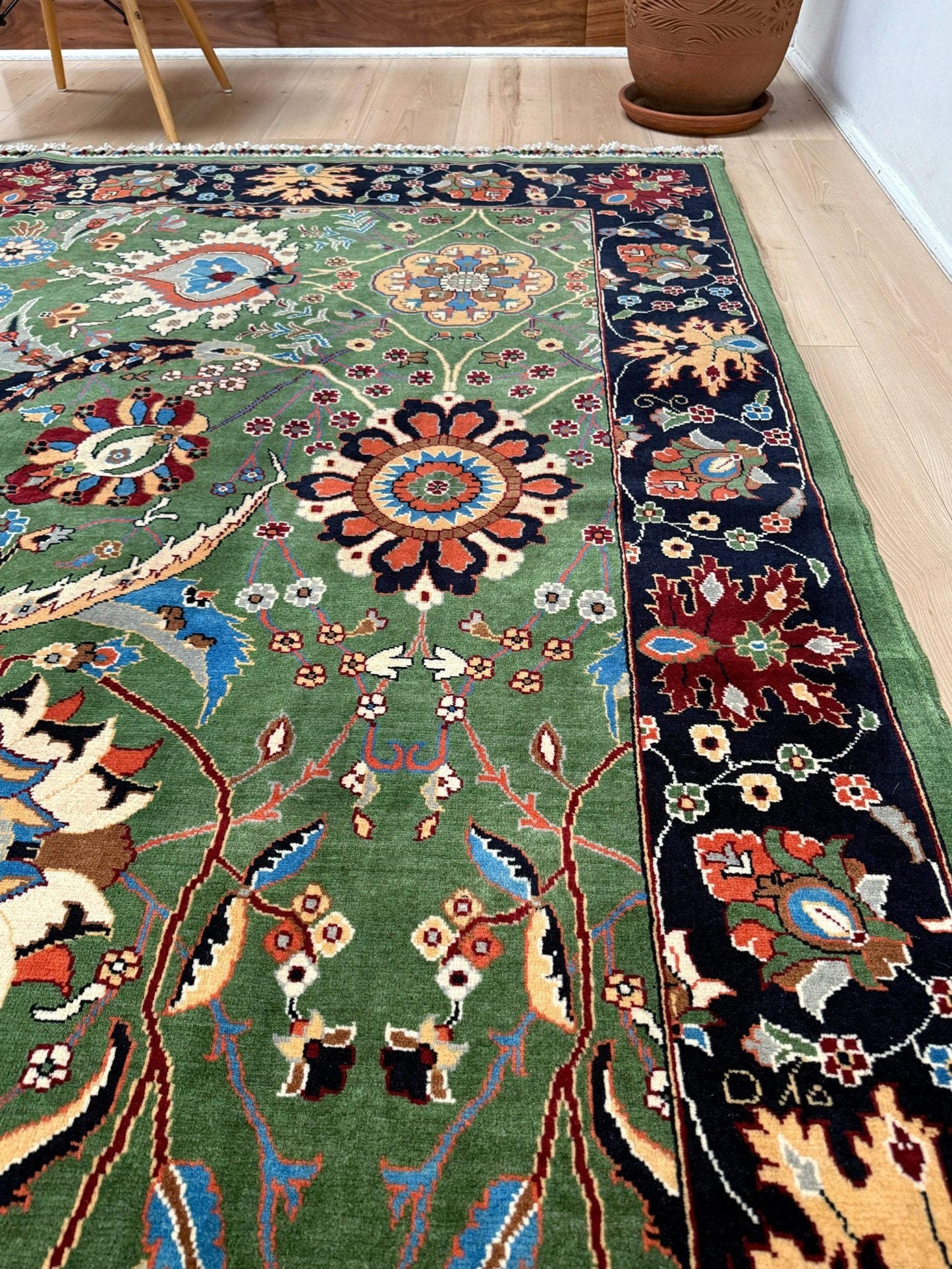 Brand new 9x12 Persian sickle leaf rug with verdant green, navy, and crimson hues, available at the best rug shop in San Mateo, SF Bay Area. Handwoven with intricate floral and vine patterns, perfect for a bedroom, living room, or dining space. High-quality wool rug with rich character and timeless elegance. Free shipping available.