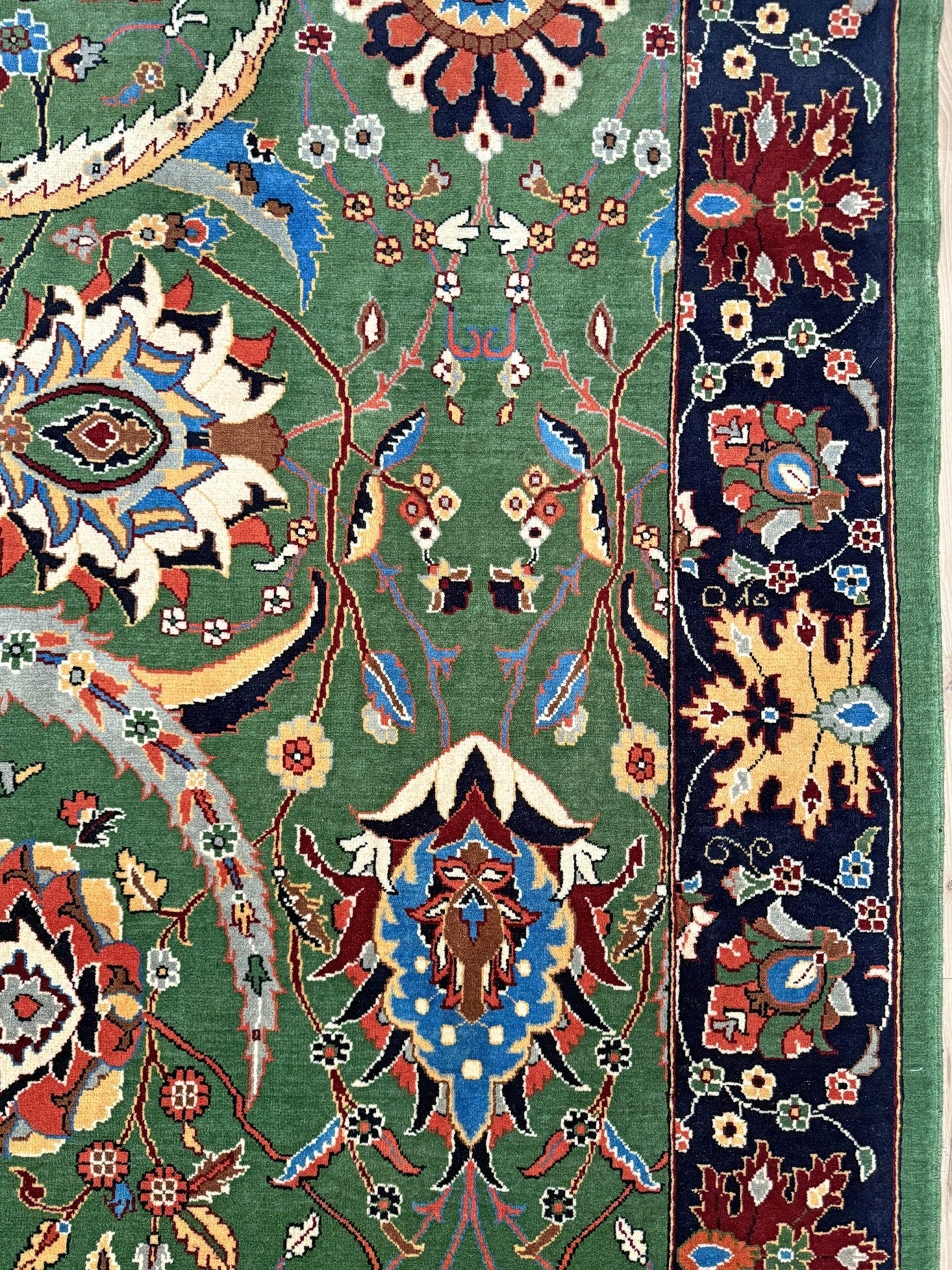 Brand new 9x12 Persian sickle leaf rug with verdant green, navy, and crimson hues, available at the best rug shop in San Mateo, SF Bay Area. Handwoven with intricate floral and vine patterns, perfect for a bedroom, living room, or dining space. High-quality wool rug with rich character and timeless elegance. Free shipping available.