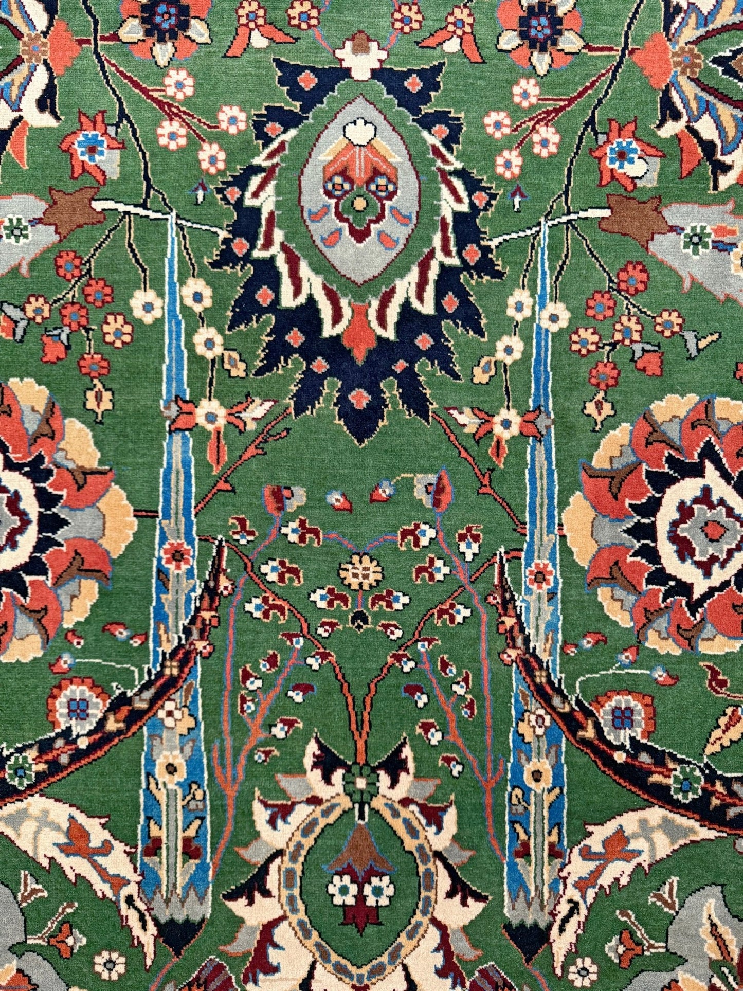 Brand new 9x12 Persian sickle leaf rug with verdant green, navy, and crimson hues, available at the best rug shop in San Mateo, SF Bay Area. Handwoven with intricate floral and vine patterns, perfect for a bedroom, living room, or dining space. High-quality wool rug with rich character and timeless elegance. Free shipping available.