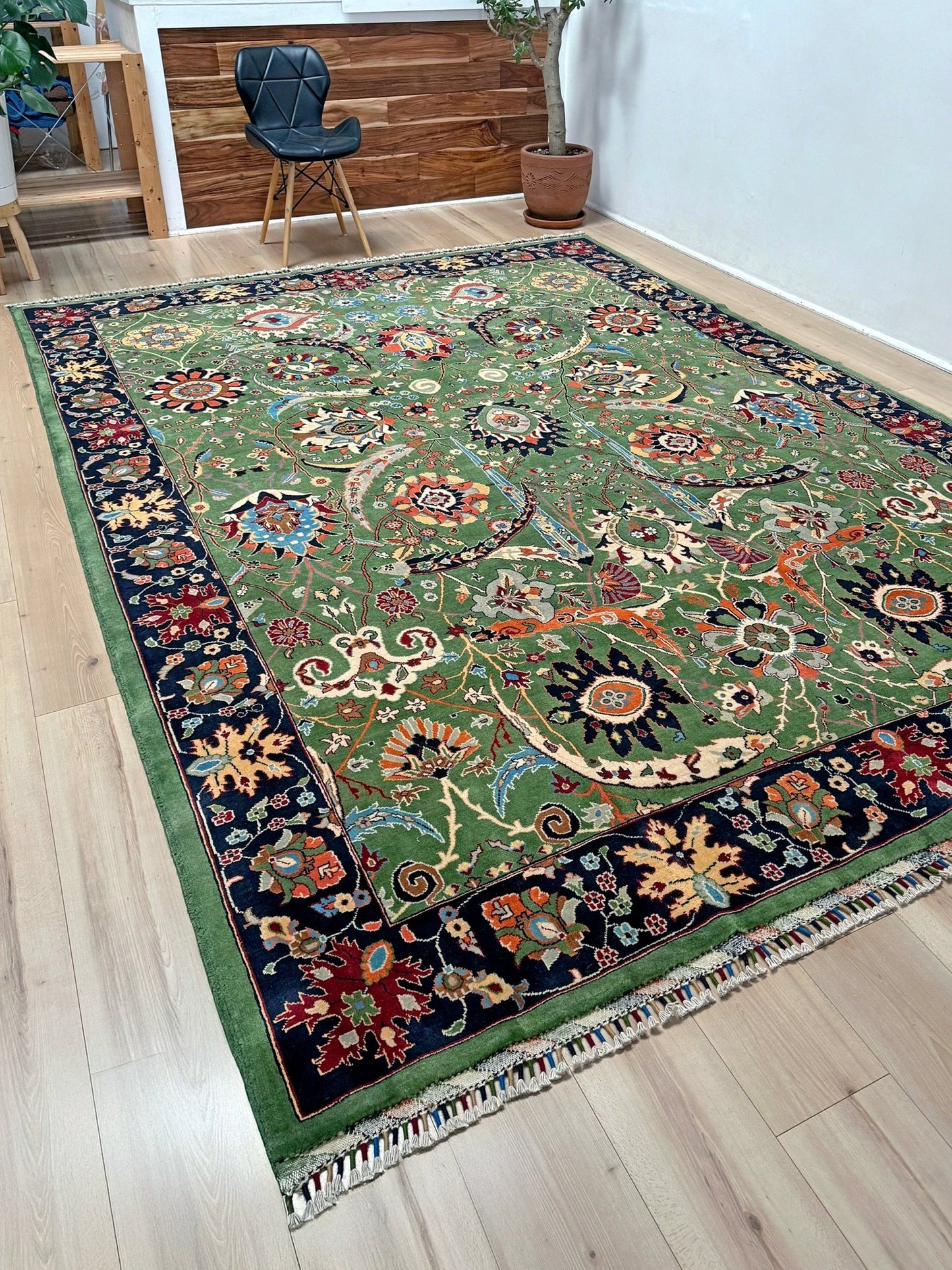 Brand new 9x12 Persian sickle leaf rug with verdant green, navy, and crimson hues, available at the best rug shop in San Mateo, SF Bay Area. Handwoven with intricate floral and vine patterns, perfect for a bedroom, living room, or dining space. High-quality wool rug with rich character and timeless elegance. Free shipping available.