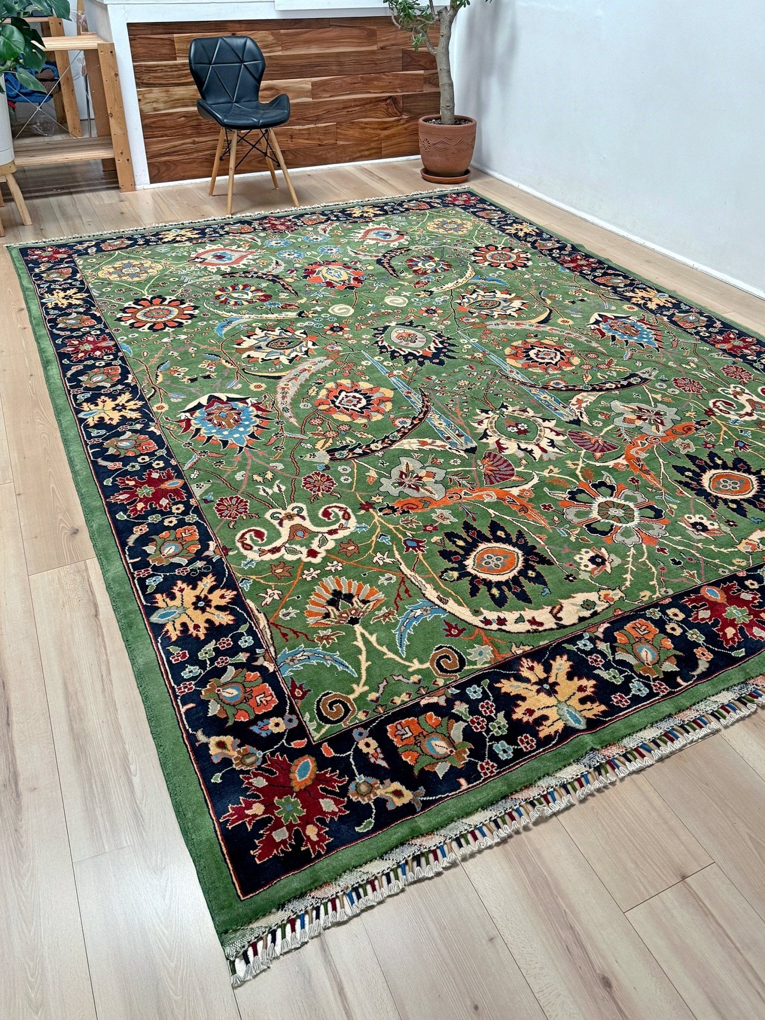 Brand new 9x12 Persian sickle leaf rug with verdant green, navy, and crimson hues, available at the best rug shop in San Mateo, SF Bay Area. Handwoven with intricate floral and vine patterns, perfect for a bedroom, living room, or dining space. High-quality wool rug with rich character and timeless elegance. Free shipping available.