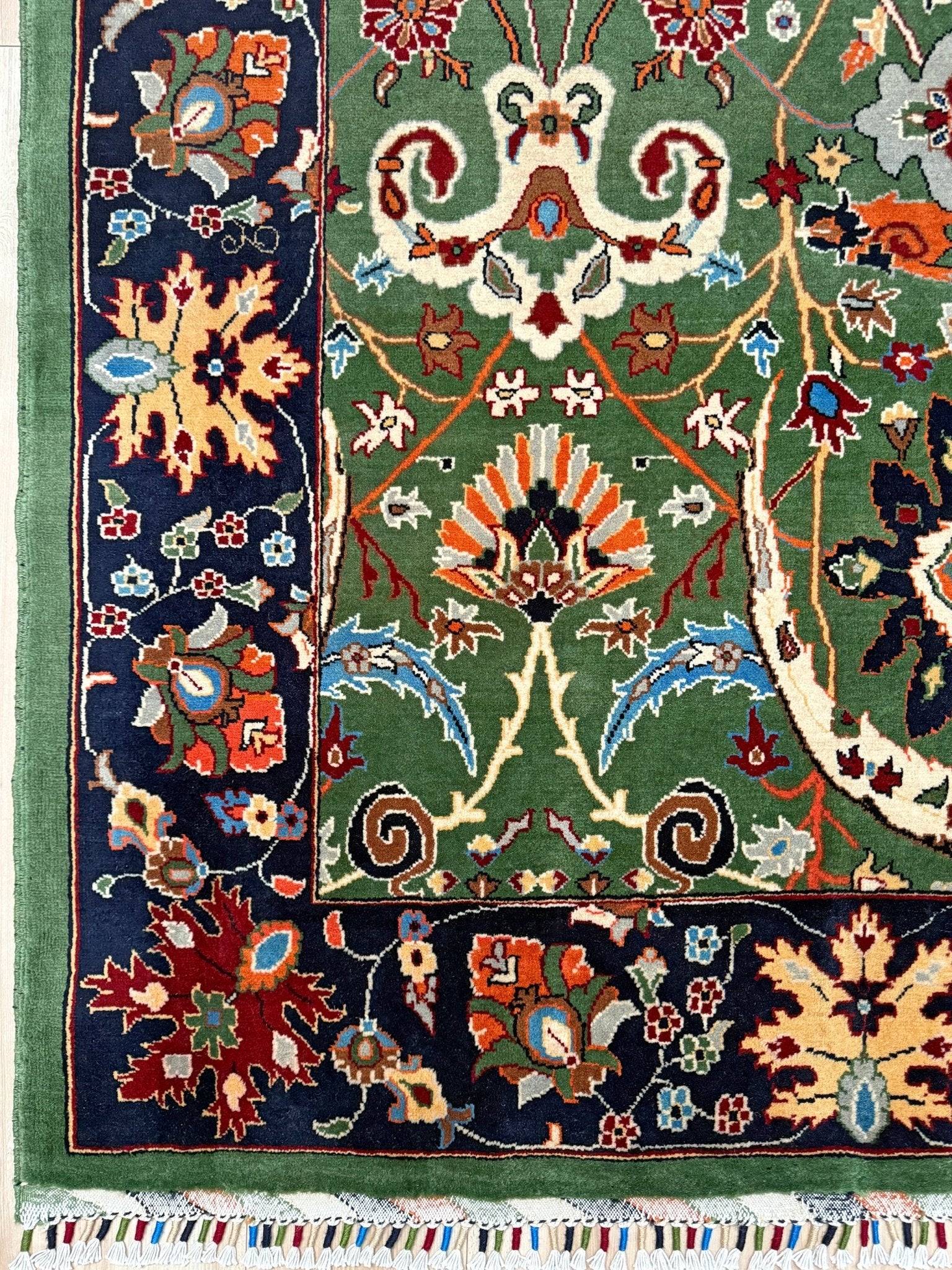 Brand new 9x12 Persian sickle leaf rug with verdant green, navy, and crimson hues, available at the best rug shop in San Mateo, SF Bay Area. Handwoven with intricate floral and vine patterns, perfect for a bedroom, living room, or dining space. High-quality wool rug with rich character and timeless elegance. Free shipping available.