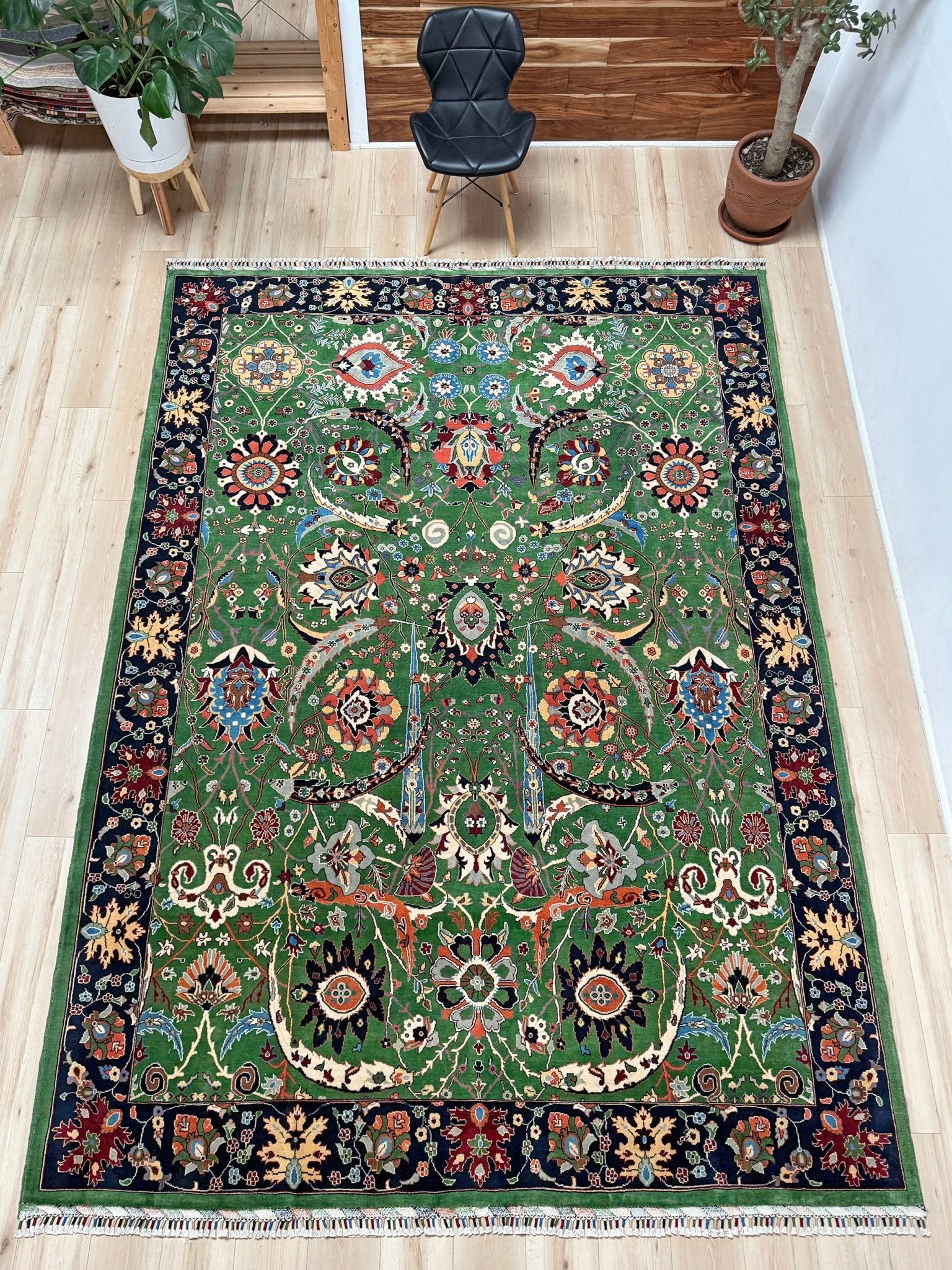 Brand new 9x12 Persian sickle leaf rug with verdant green, navy, and crimson hues, available at the best rug shop in San Mateo, SF Bay Area. Handwoven with intricate floral and vine patterns, perfect for a bedroom, living room, or dining space. High-quality wool rug with rich character and timeless elegance. Free shipping available.