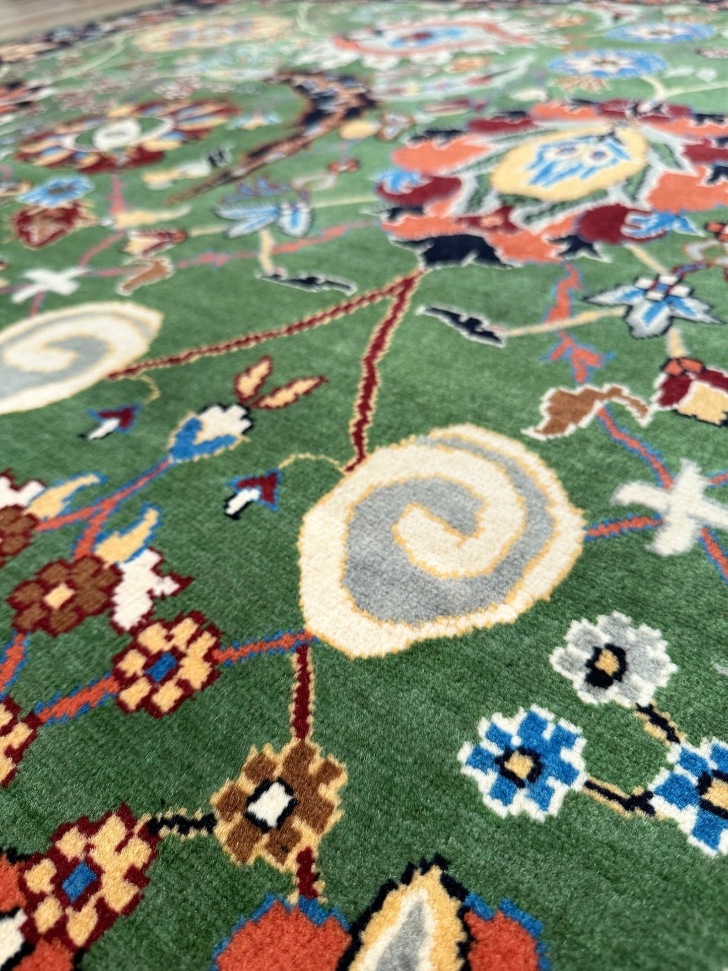 Brand new 9x12 Persian sickle leaf rug with verdant green, navy, and crimson hues, available at the best rug shop in San Mateo, SF Bay Area. Handwoven with intricate floral and vine patterns, perfect for a bedroom, living room, or dining space. High-quality wool rug with rich character and timeless elegance. Free shipping available.