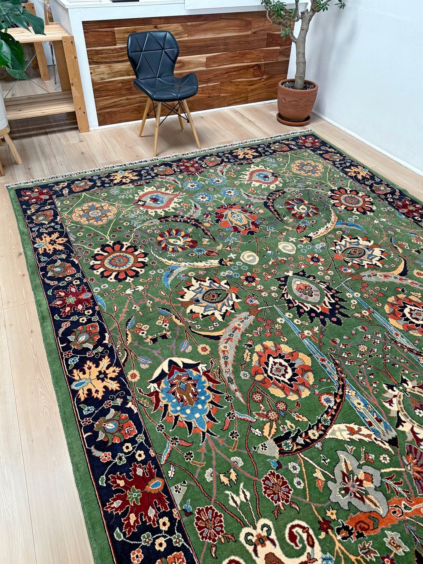 Brand new 9x12 Persian sickle leaf rug with verdant green, navy, and crimson hues, available at the best rug shop in San Mateo, SF Bay Area. Handwoven with intricate floral and vine patterns, perfect for a bedroom, living room, or dining space. High-quality wool rug with rich character and timeless elegance. Free shipping available.