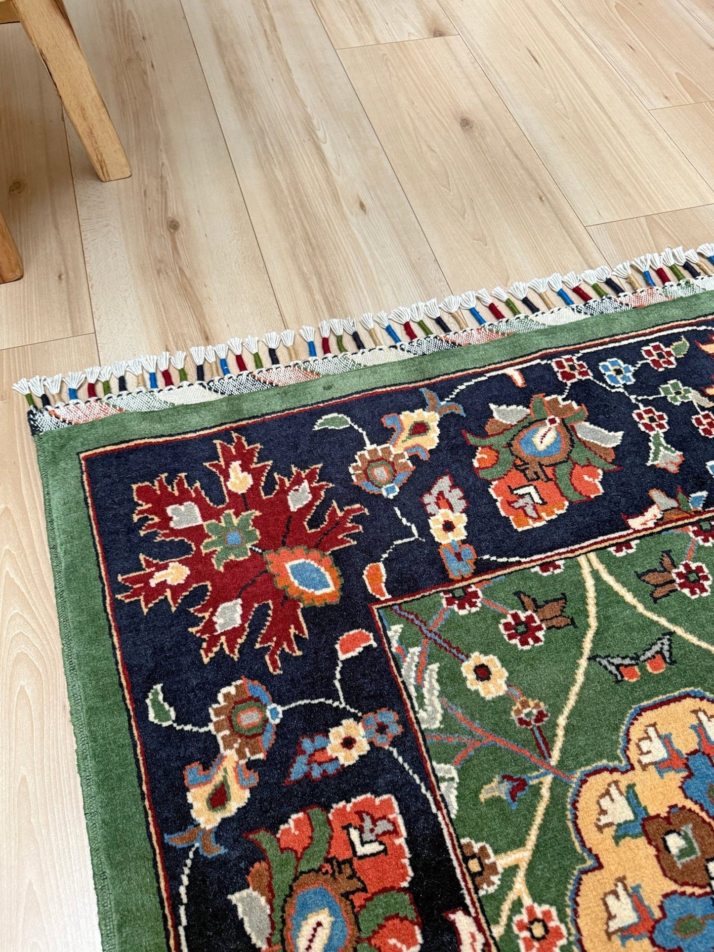 Brand new 9x12 Persian sickle leaf rug with verdant green, navy, and crimson hues, available at the best rug shop in San Mateo, SF Bay Area. Handwoven with intricate floral and vine patterns, perfect for a bedroom, living room, or dining space. High-quality wool rug with rich character and timeless elegance. Free shipping available.