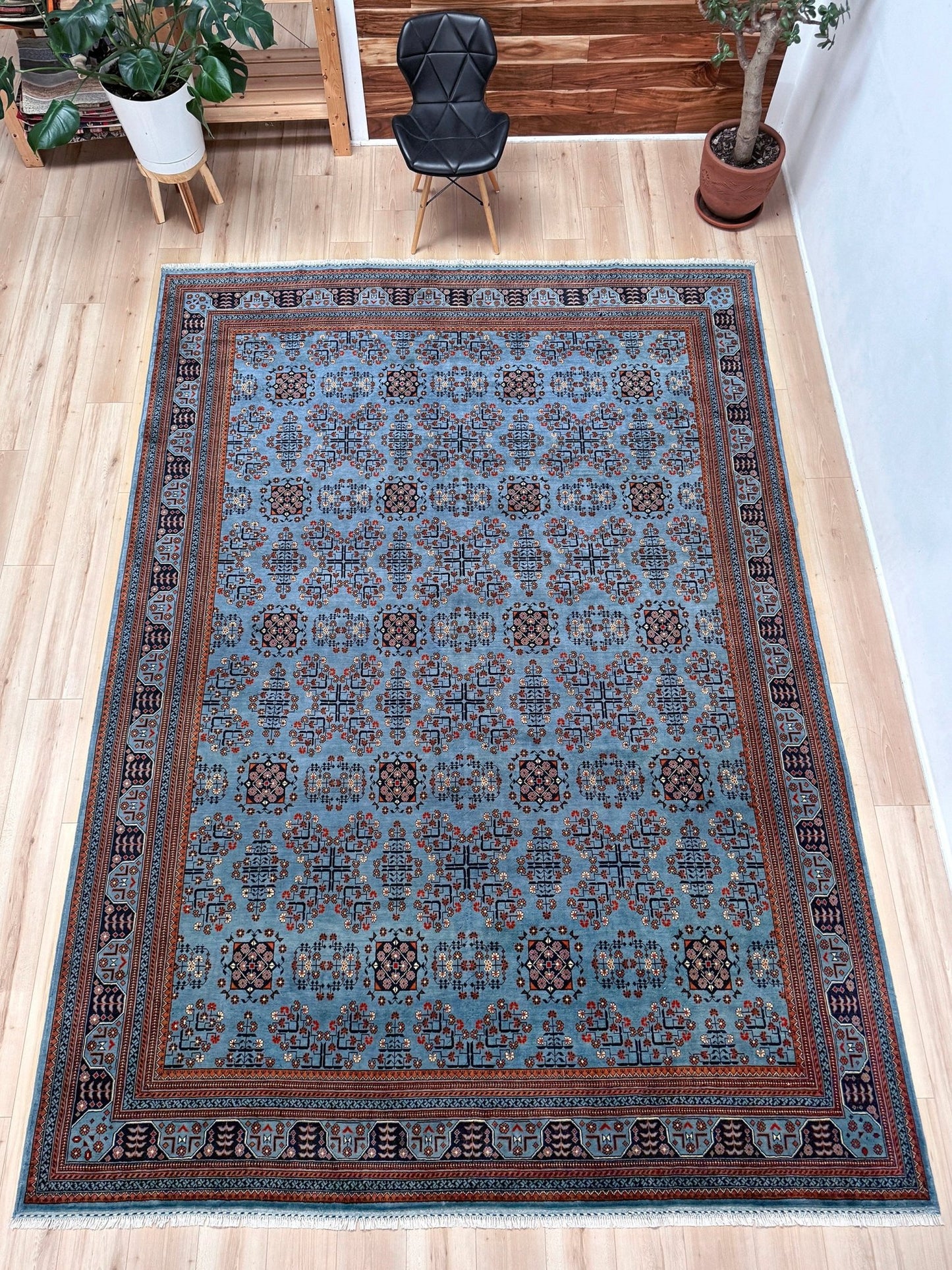 9x12 Handmade Turkmen rug with a baby blue ground, featuring traditional geometric motifs in brown, midnight blue, terracotta crafted from silky Merino wool with a luxurious sheen, available with free shipping from the best handmade rug shop Burlingame CA San Francisco Bay Area.