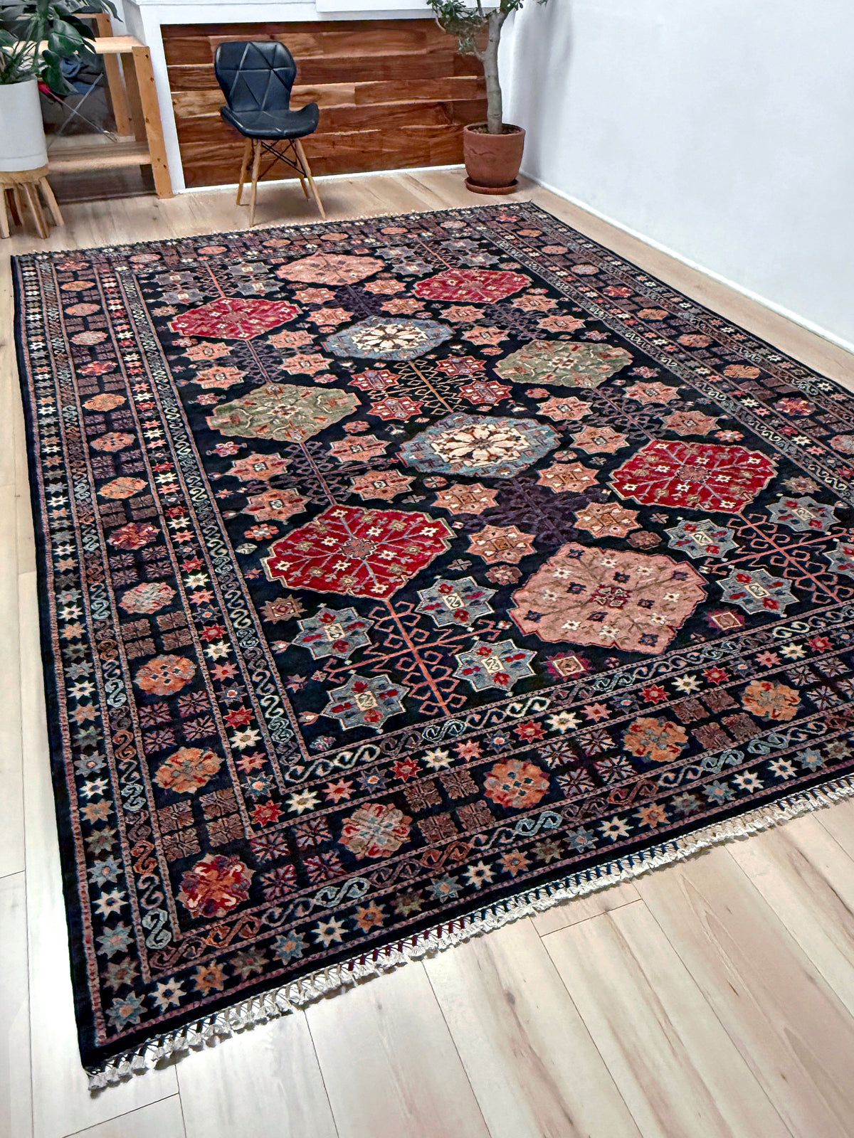 Charcoal Gendje Turkish rug with colorful allover floral medallions, crimson red, sage green, handmade wool 9x12 rug for living room, bedroom from Indigo Rugs Burlingame Bay Area.