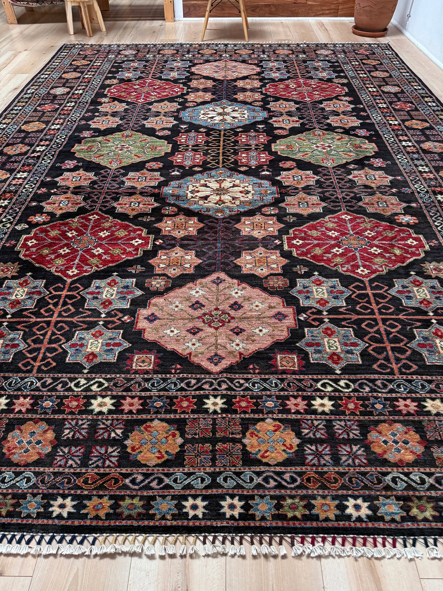 Charcoal Gendje Turkish rug with colorful allover floral medallions, crimson red, sage green, handmade wool 9x12 rug for living room, bedroom from Indigo Rugs Burlingame Bay Area.