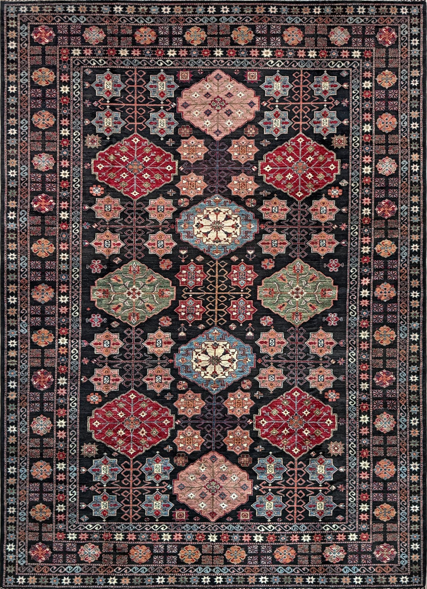 Handmade Turkmen-style 9x12 wool rug with Caucasian-inspired design, rich black, crimson, ivory, and sage hues. Luxury area rug with intricate medallions and floral motifs, perfect for bedroom, living room, or dining room. High-quality craftsmanship from the best rug shop in Burlingame CA, SF Bay Area. Free shipping, timeless character, and elegance for any space.