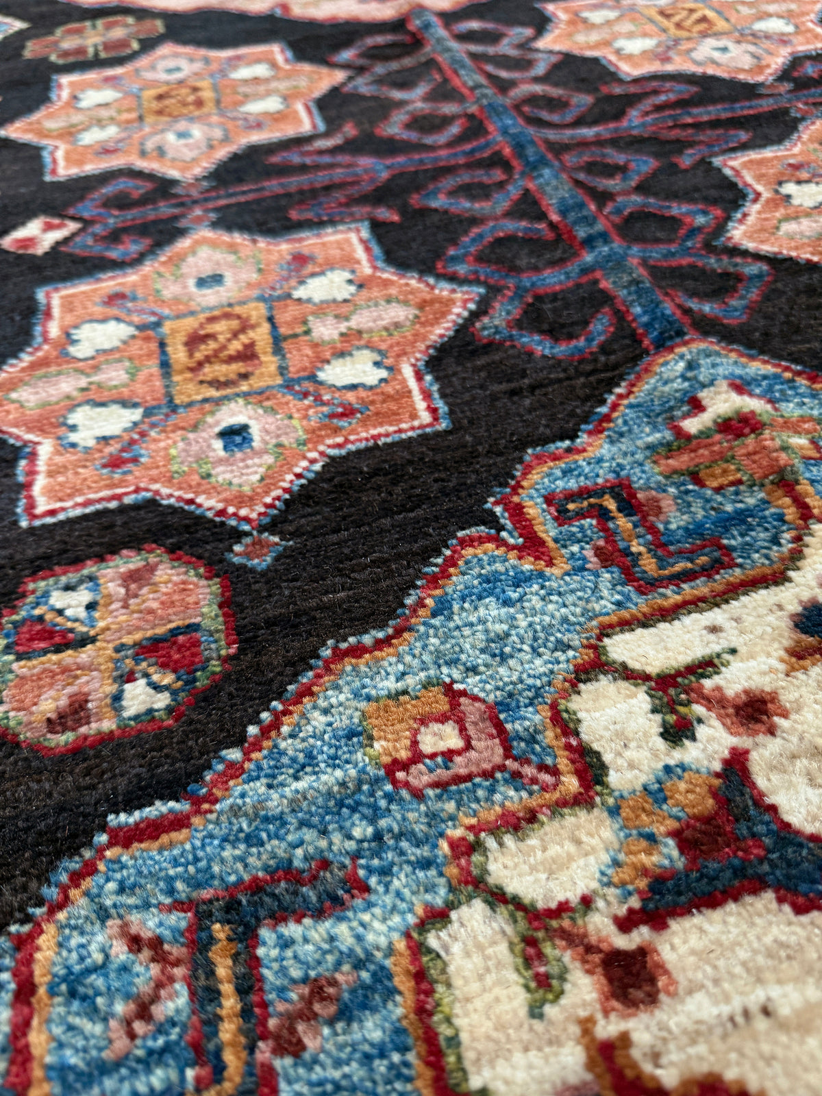 Charcoal Gendje Turkish rug with colorful allover floral medallions, crimson red, sage green, handmade wool 9x12 rug for living room, bedroom from Indigo Rugs Burlingame Bay Area.