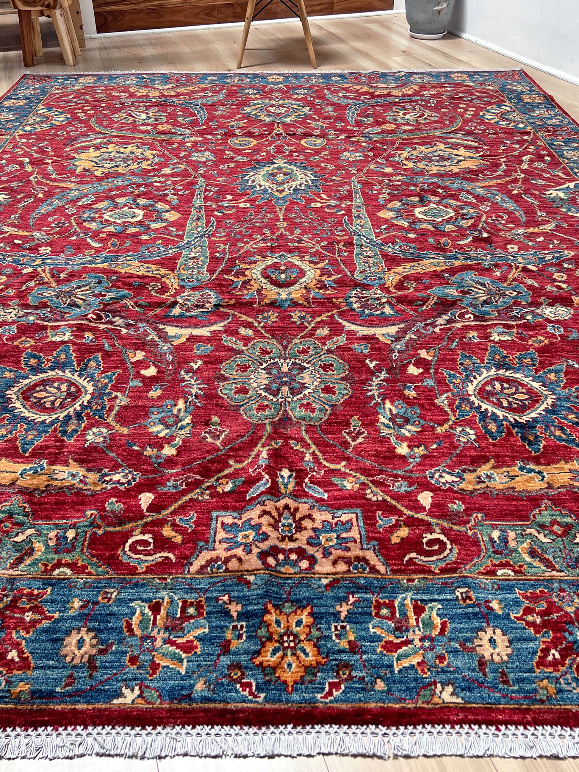 8x10 Sickle Leaf Luxury Area Rug&nbsp;• Handmade Wool Carpet large Rug for Living Room, Bedroom, Dining &amp; Office
This exquisite oriental rug features the traditional Persian sickle leaf design elegantly woven on a rich red ground. The intricate blue borders add a touch of sophistication, enhancing the rug's timeless appeal. Crafted from the finest silky wool, this rug offers both luxurious softness and exceptional durability.