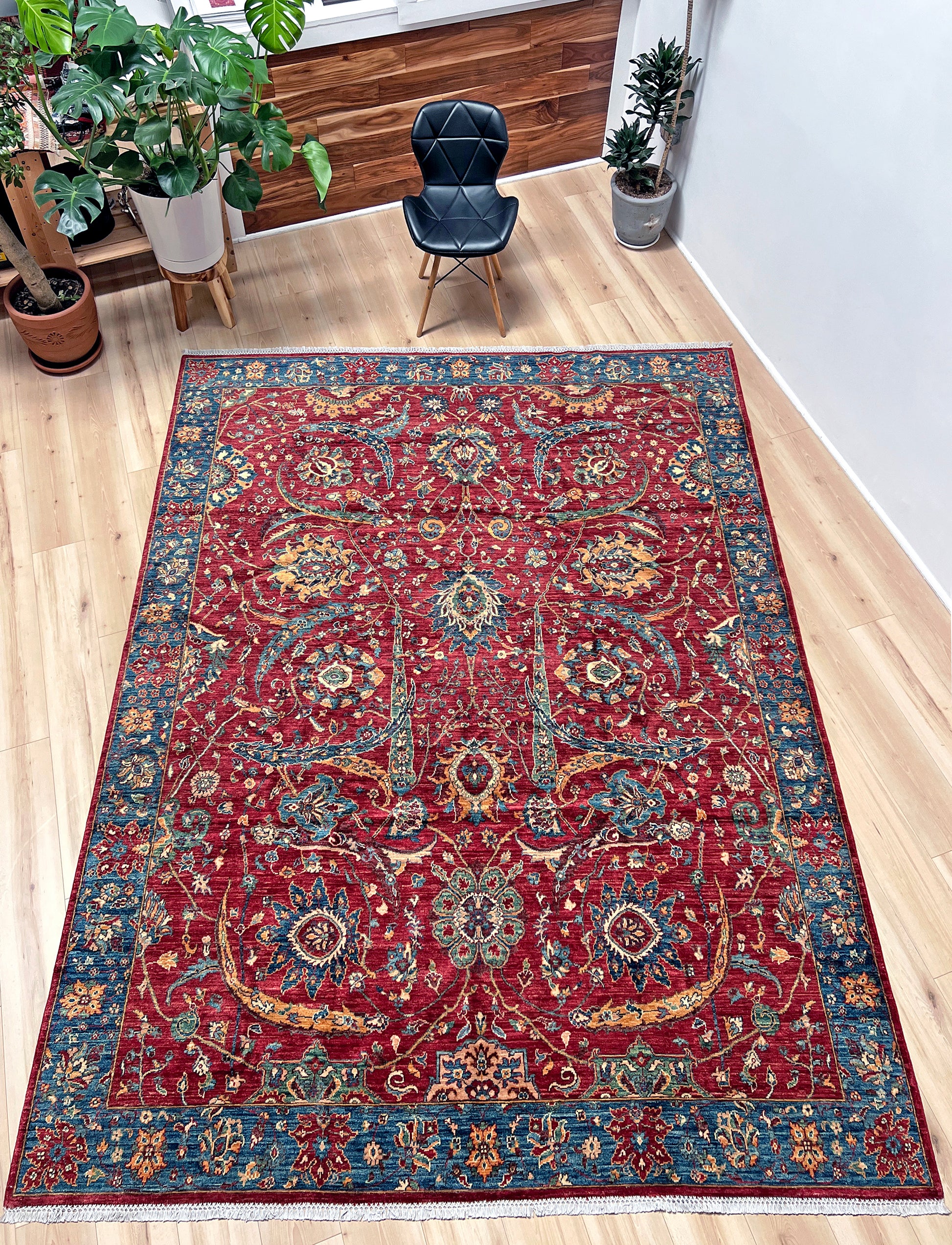 8x10 Sickle Leaf Luxury Area Rug&nbsp;• Handmade Wool Carpet large Rug for Living Room, Bedroom, Dining &amp; Office
This exquisite oriental rug features the traditional Persian sickle leaf design elegantly woven on a rich red ground. The intricate blue borders add a touch of sophistication, enhancing the rug's timeless appeal. Crafted from the finest silky wool, this rug offers both luxurious softness and exceptional durability.