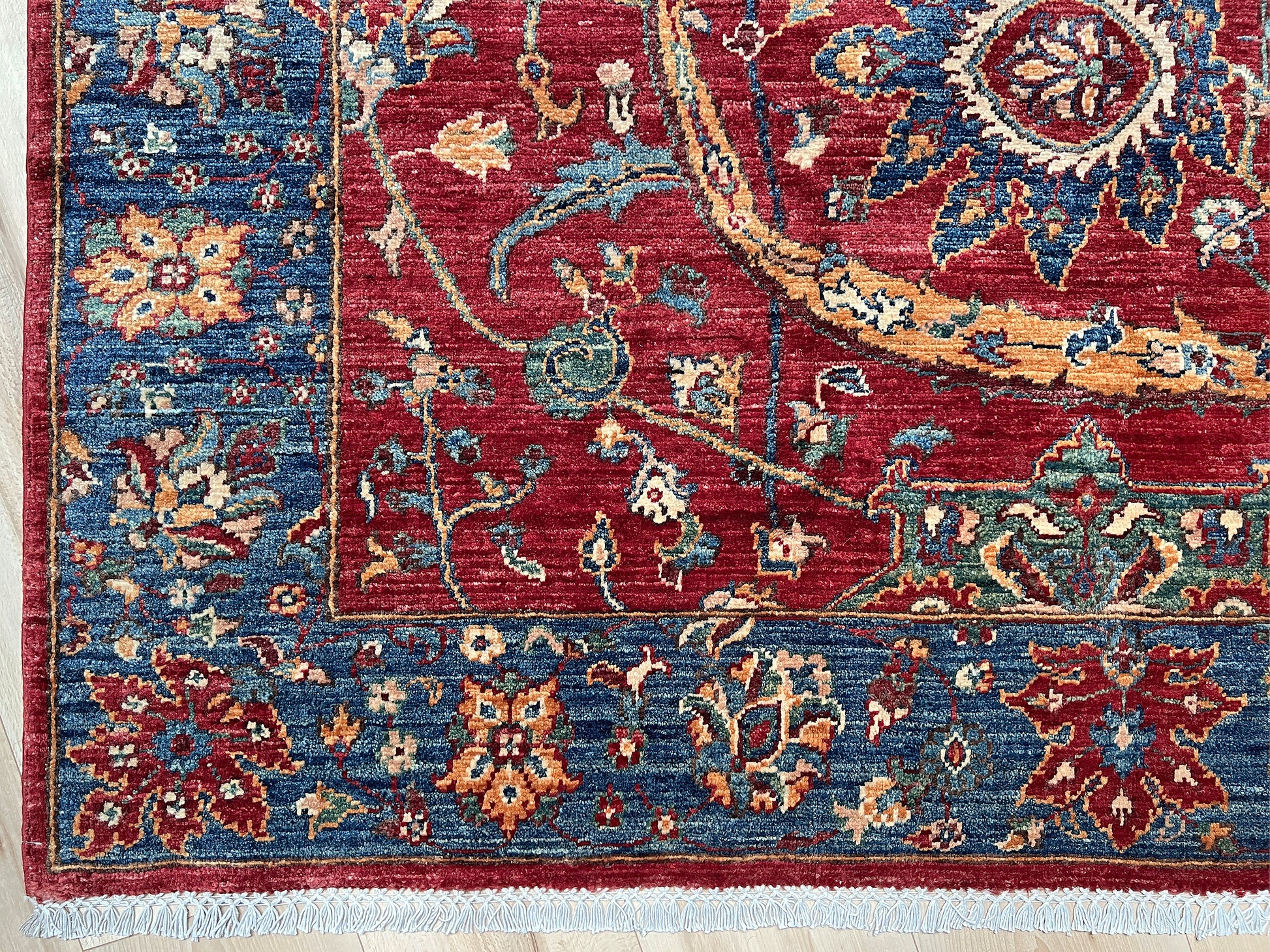 8x10 Sickle Leaf Luxury Area Rug&nbsp;• Handmade Wool Carpet large Rug for Living Room, Bedroom, Dining &amp; Office
This exquisite oriental rug features the traditional Persian sickle leaf design elegantly woven on a rich red ground. The intricate blue borders add a touch of sophistication, enhancing the rug's timeless appeal. Crafted from the finest silky wool, this rug offers both luxurious softness and exceptional durability.