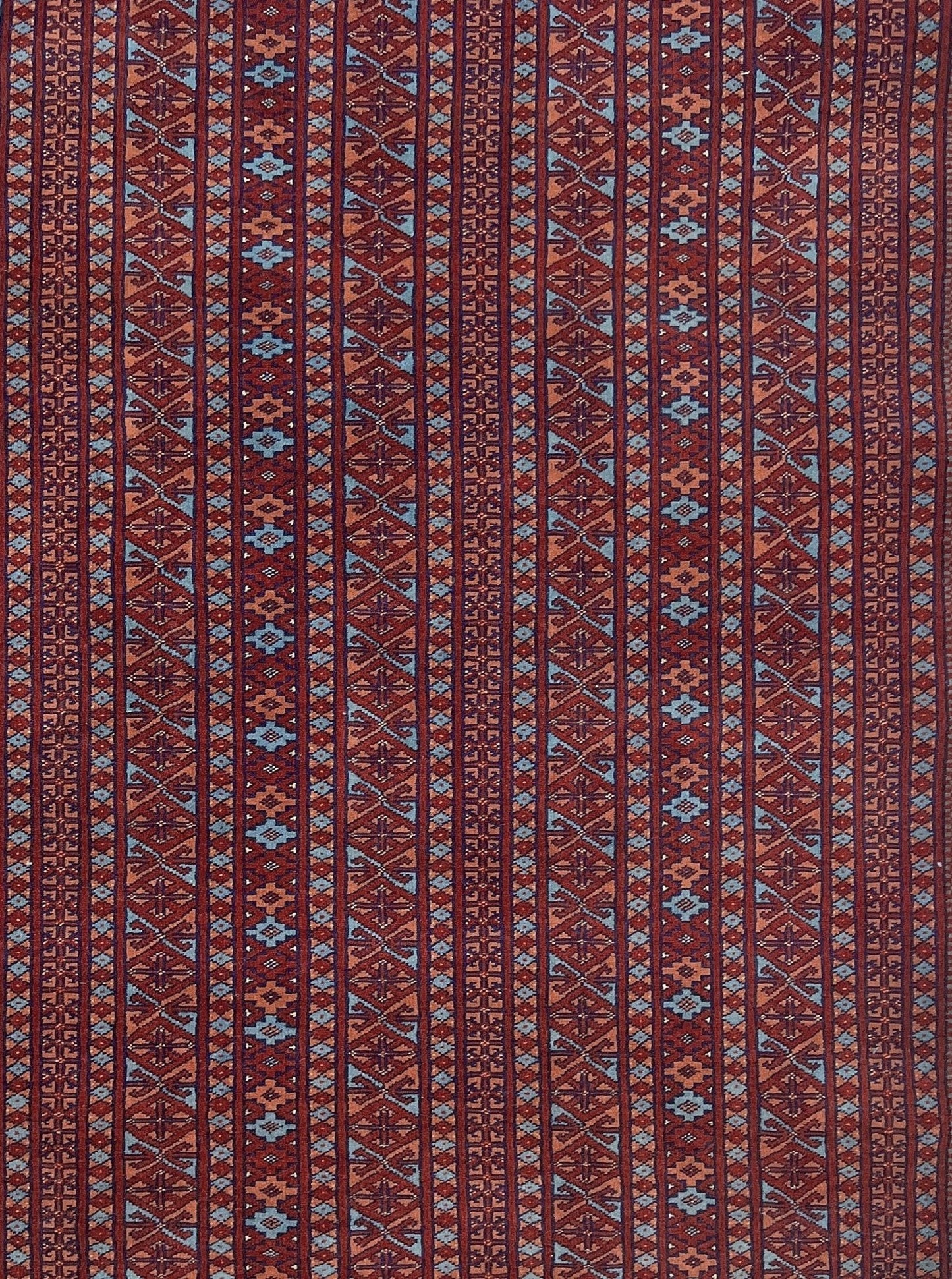 Vintage Uzbek Bukhara rug with sky blue field and repeating brick red gul motifs, navy borders, large handmade merino wool area rug 10x14 with velvety pile from Indigo Rugs Burlingame Bay Area