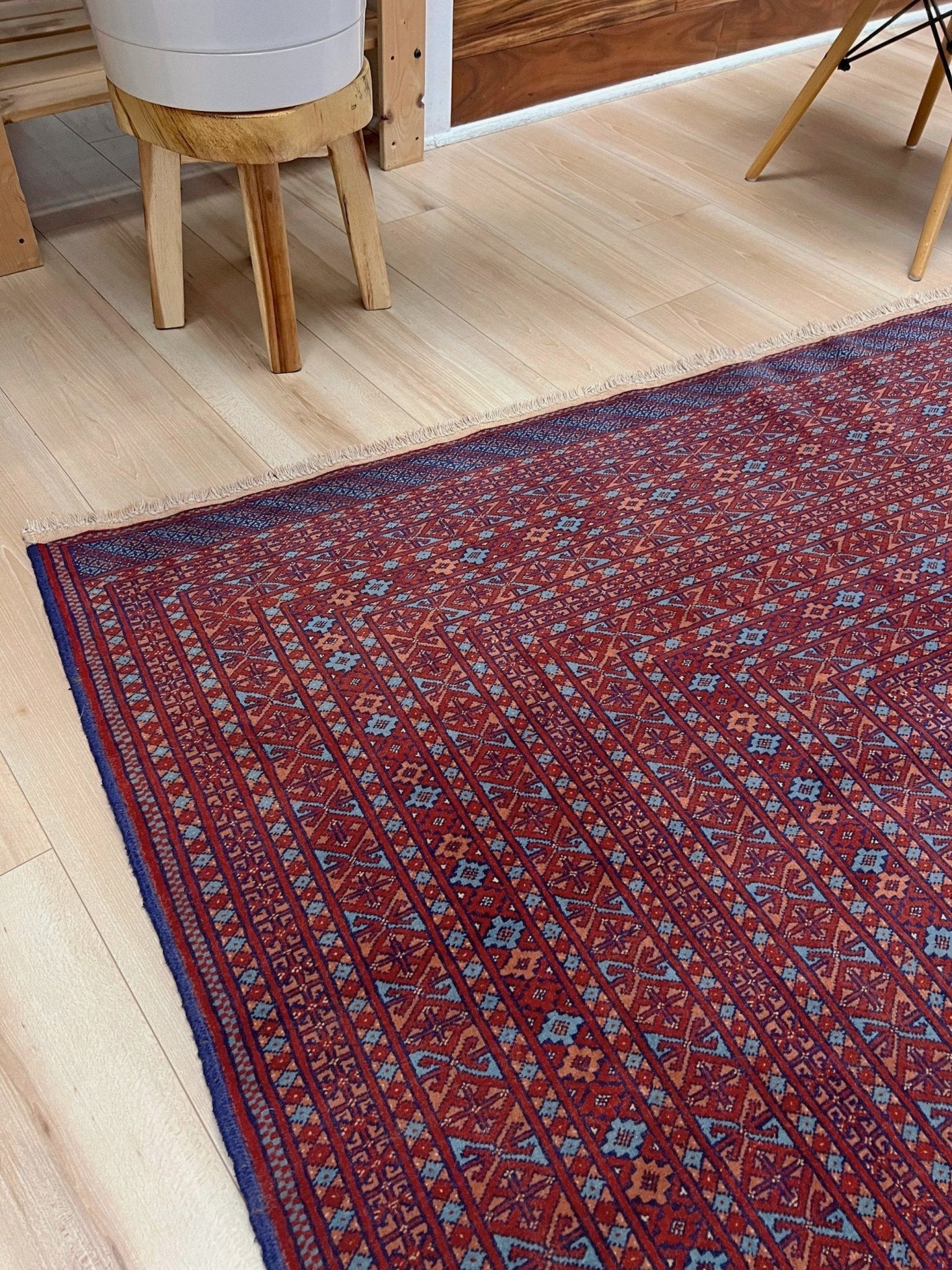 Vintage Uzbek Bukhara rug with sky blue field and repeating brick red gul motifs, navy borders, large handmade merino wool area rug 10x14 with velvety pile from Indigo Rugs Burlingame Bay Area