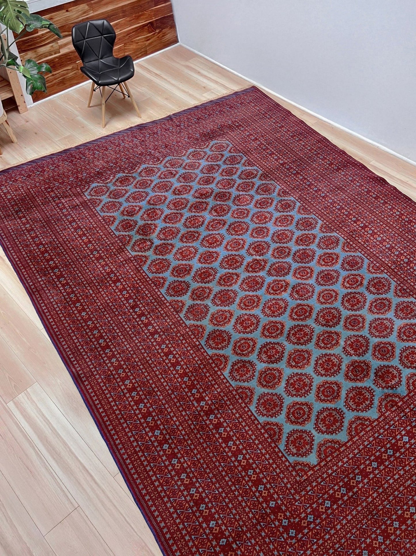Vintage Uzbek Bukhara rug with sky blue field and repeating brick red gul motifs, navy borders, large handmade merino wool area rug 10x14 with velvety pile from Indigo Rugs Burlingame Bay Area
