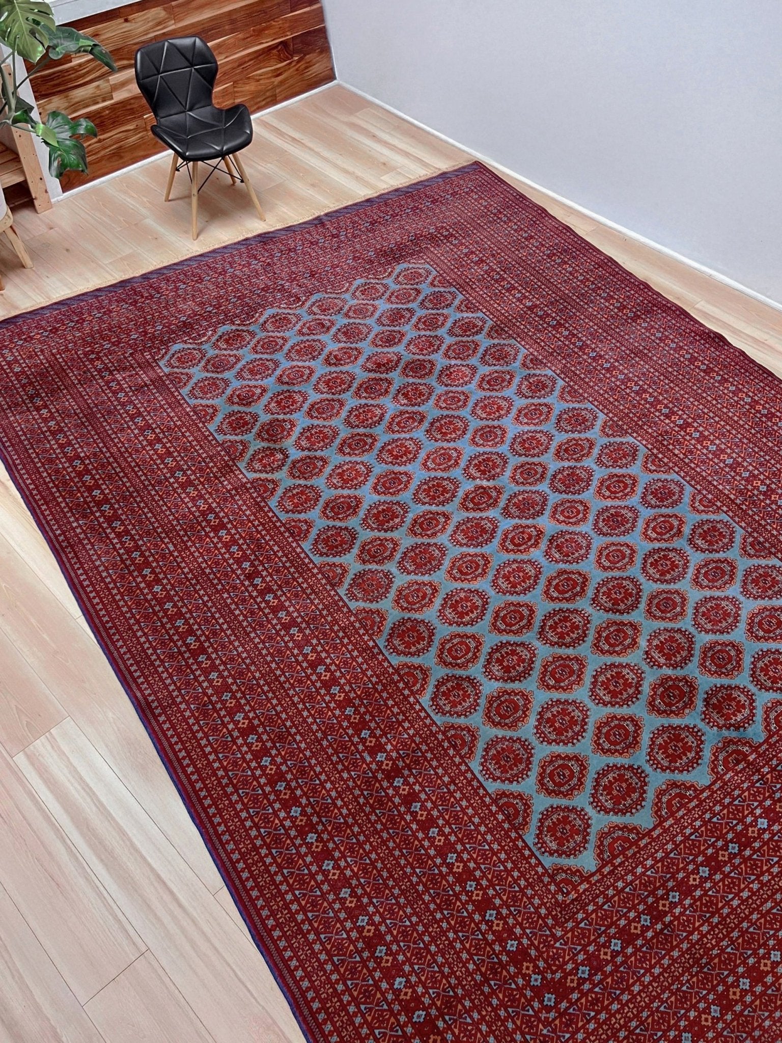 Vintage Uzbek Bukhara rug with sky blue field and repeating brick red gul motifs, navy borders, large handmade merino wool area rug 10x14 with velvety pile from Indigo Rugs Burlingame Bay Area