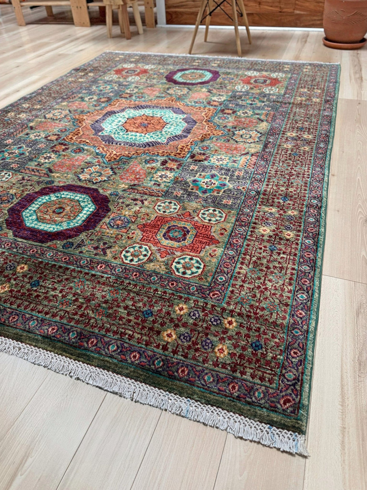 Handmade 6x8 Mamluk rug with a sage green field with terracotta, turquoise, navy, coral, and plum motifs, perfect for living room, bedroom, kitchen, or dining room. The best rug shop in Burlingame, SF Bay Area.