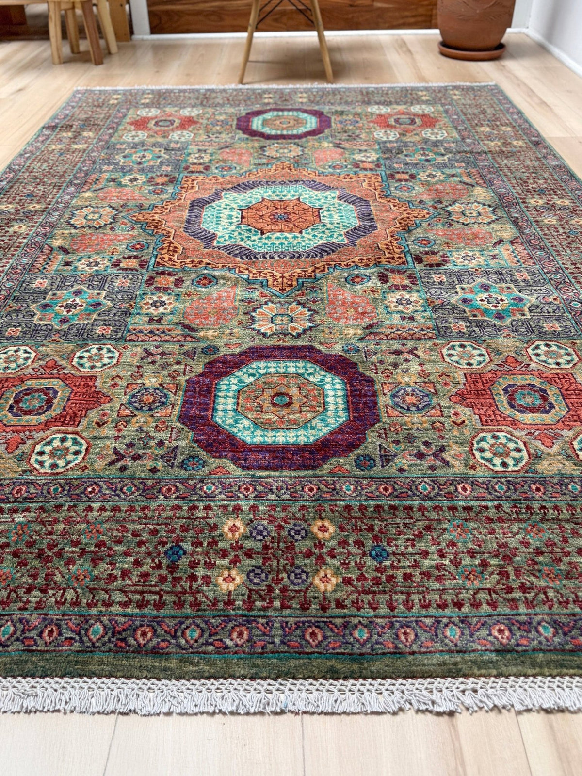 Handmade 6x8 Mamluk rug with a sage green field with terracotta, turquoise, navy, coral, and plum motifs, perfect for living room, bedroom, kitchen, or dining room. The best rug shop in Burlingame, SF Bay Area.