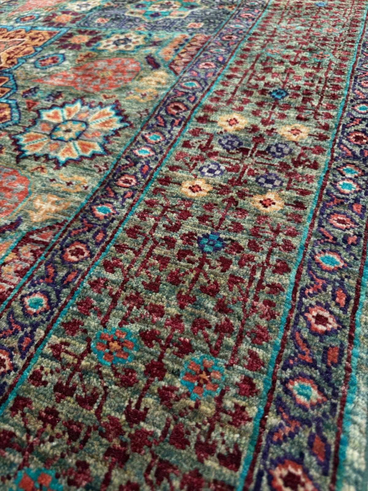 Handmade 6x8 Mamluk rug with a sage green field with terracotta, turquoise, navy, coral, and plum motifs, perfect for living room, bedroom, kitchen, or dining room. The best rug shop in Burlingame, SF Bay Area.