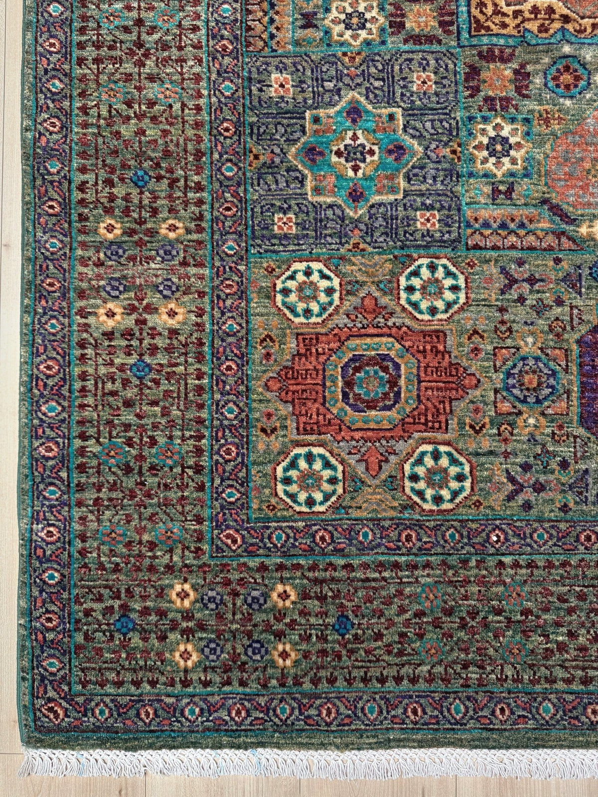 Handmade 6x8 Mamluk rug with a sage green field with terracotta, turquoise, navy, coral, and plum motifs, perfect for living room, bedroom, kitchen, or dining room. The best rug shop in Burlingame, SF Bay Area.