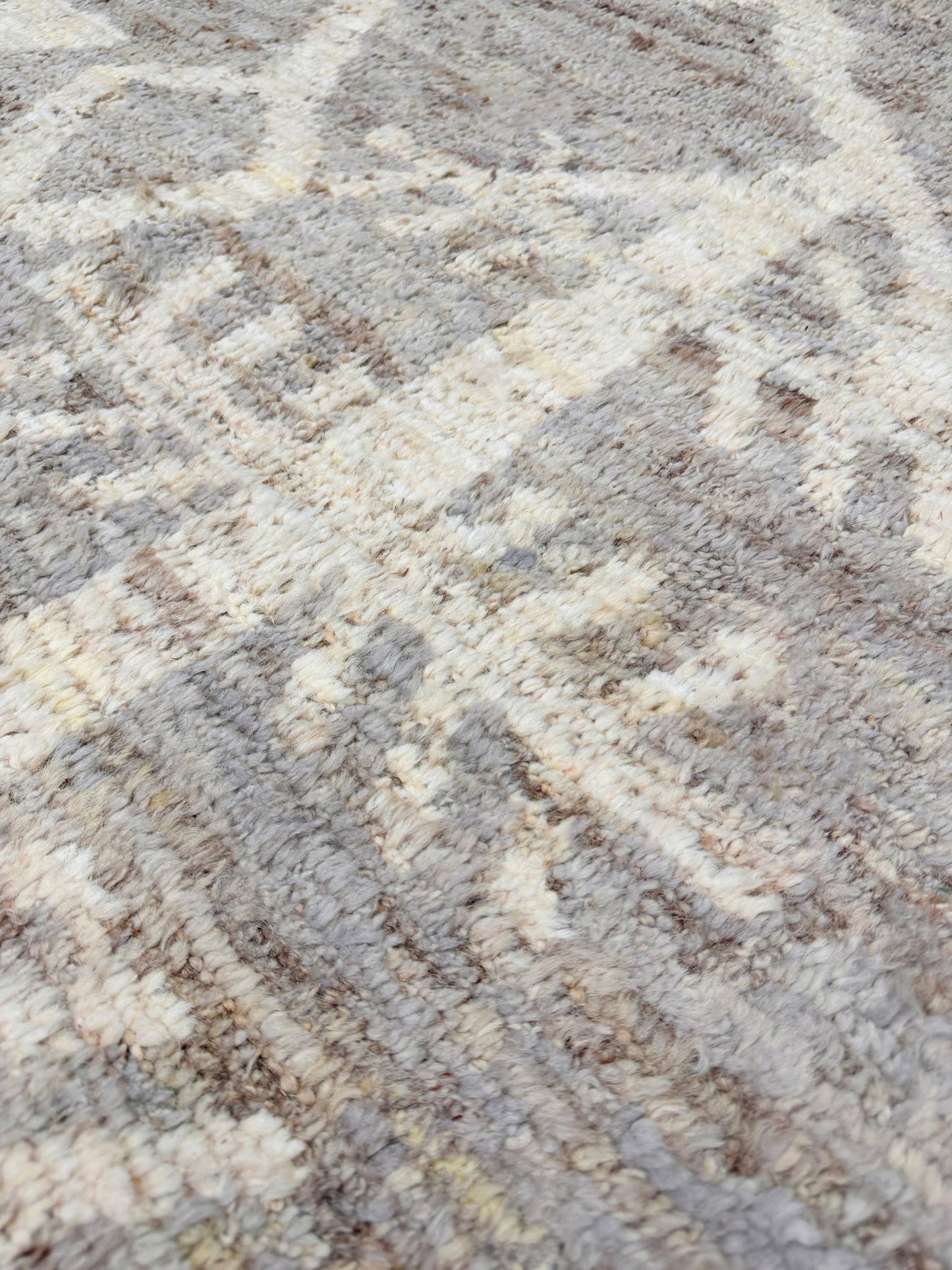 Brand new 9x12 Turkish Tulu Organic Modern  rug with warm greige field, soft ivory abstract tribal motifs, taupe and oatmeal tones, handmade wool area rug from Indigo Rugs Burlingame Bay Area.