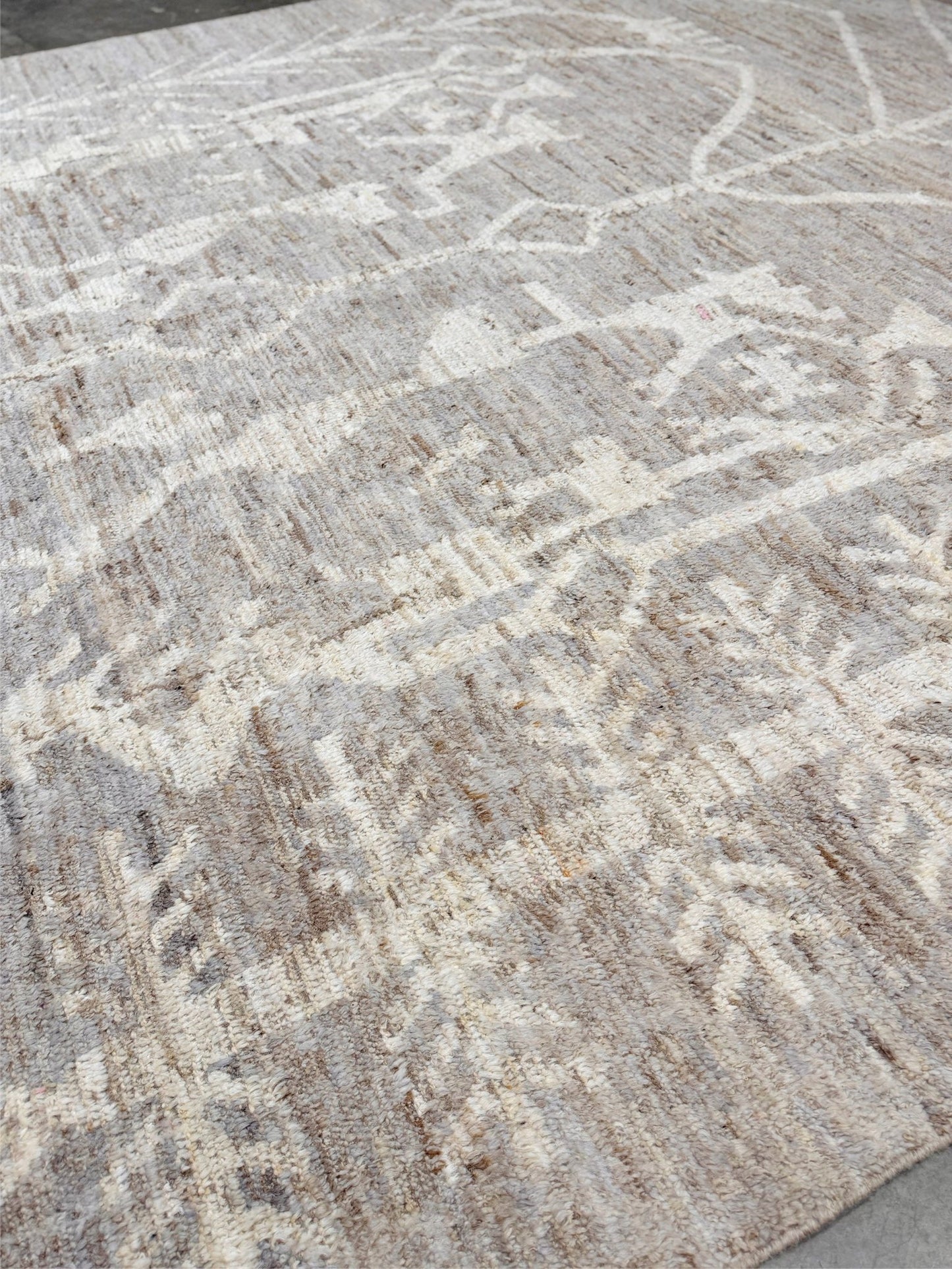 Brand new 9x12 Turkish Tulu Organic Modern  rug with warm greige field, soft ivory abstract tribal motifs, taupe and oatmeal tones, handmade wool area rug from Indigo Rugs Burlingame Bay Area.