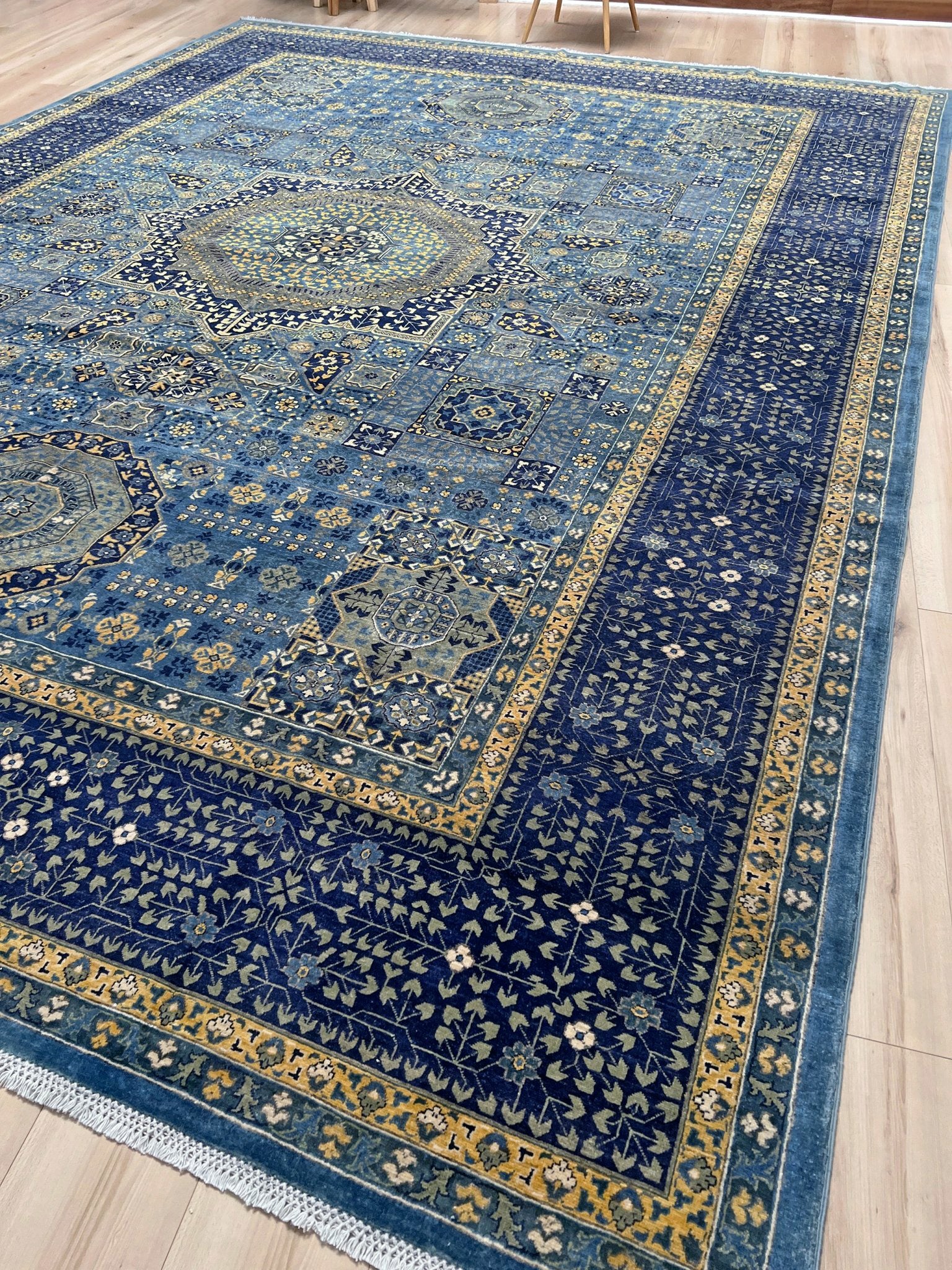 Decorative blue rug with intricate patterns. Brand new fine Mamluk rug 10x14 with navy, denim blue, and soft gold geometric medallion design, high knot density (50×50 ~156 KPSI), perfect for large living rooms and dining spaces. From Indigo Rugs, Burlingame — the best rug shop in the San Francisco Bay Area. Free shipping.