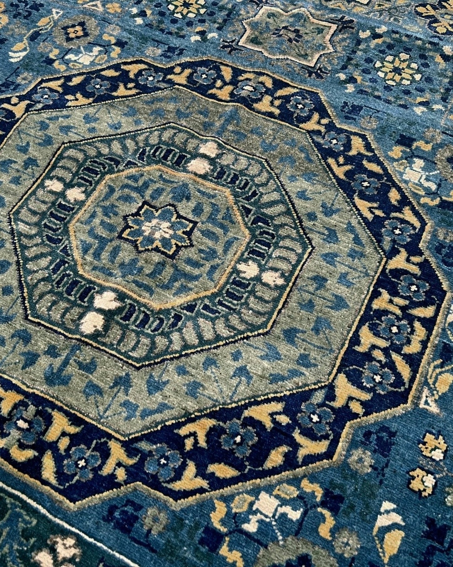 Decorative blue rug with intricate patterns. Brand new fine Mamluk rug 10x14 with navy, denim blue, and soft gold geometric medallion design, high knot density (50×50 ~156 KPSI), perfect for large living rooms and dining spaces. From Indigo Rugs, Burlingame — the best rug shop in the San Francisco Bay Area. Free shipping.
