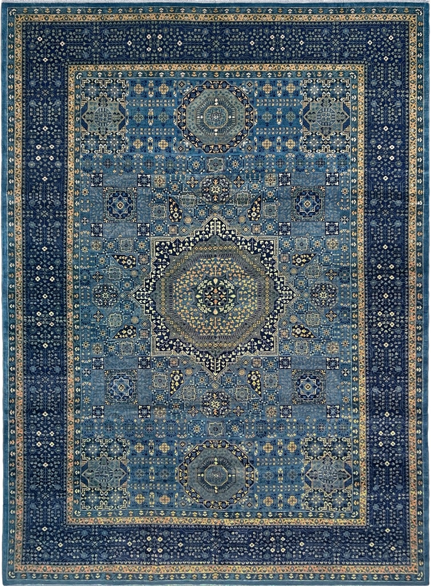 Decorative blue rug with intricate patterns. Brand new fine Mamluk rug 10x14 with navy, denim blue, and soft gold geometric medallion design, high knot density (50×50 ~156 KPSI), perfect for large living rooms and dining spaces. From Indigo Rugs, Burlingame — the best rug shop in the San Francisco Bay Area. Free shipping.