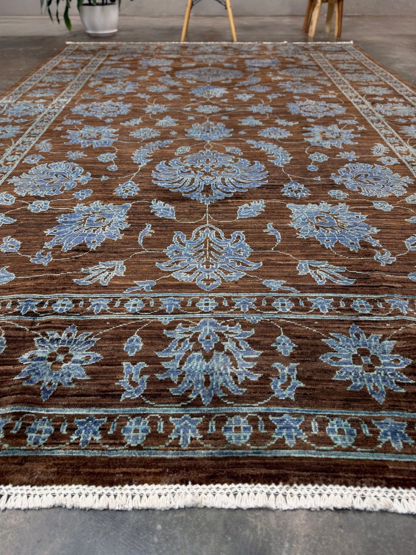 Brand new handmade floral rug with walnut brown, blue and soft turquoise accents, wool area rug 7x9 from Indigo Rugs Burlingame Bay Area.