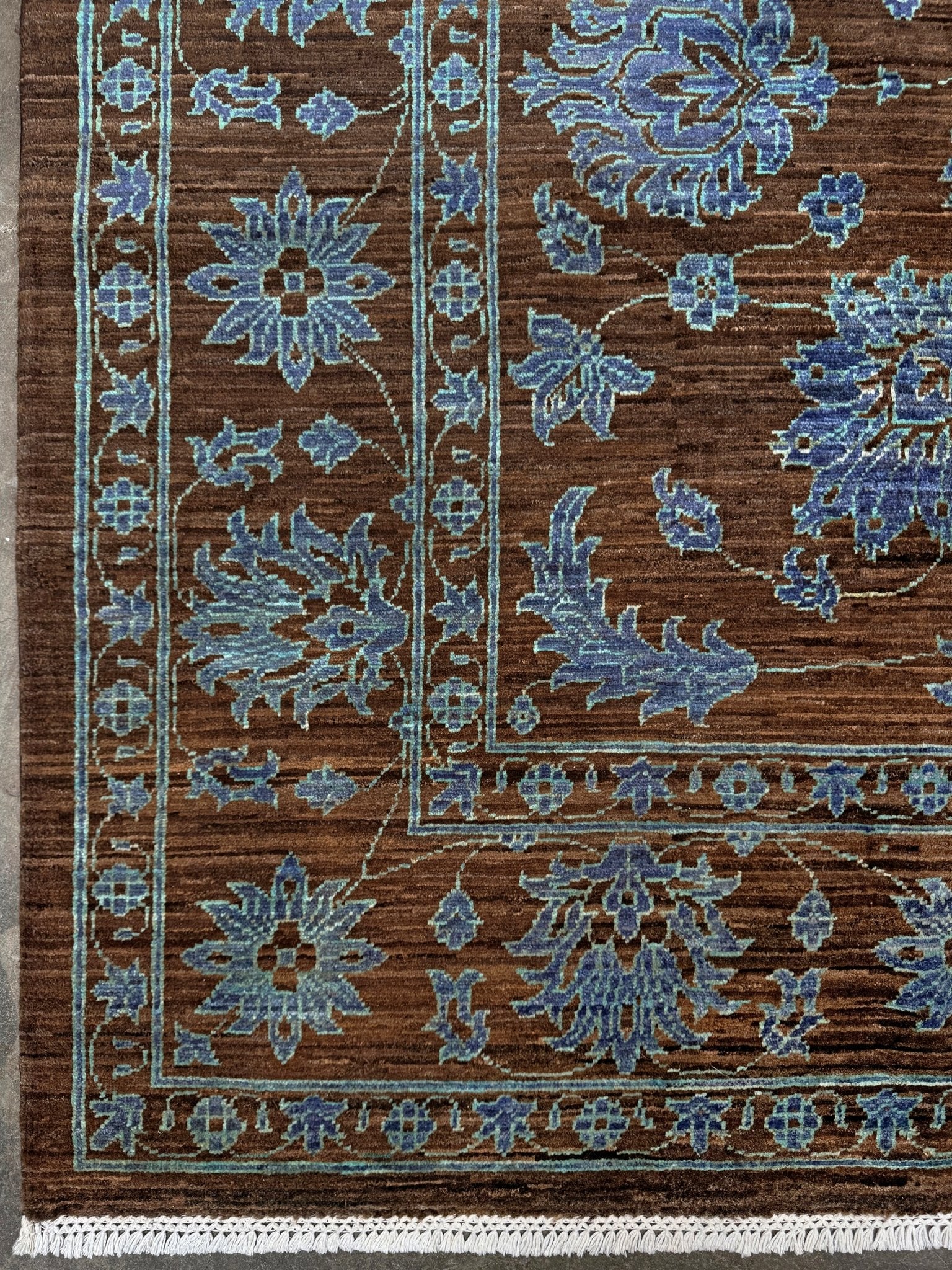 Brand new handmade floral rug with walnut brown, blue and soft turquoise accents, wool area rug 7x9 from Indigo Rugs Burlingame Bay Area.