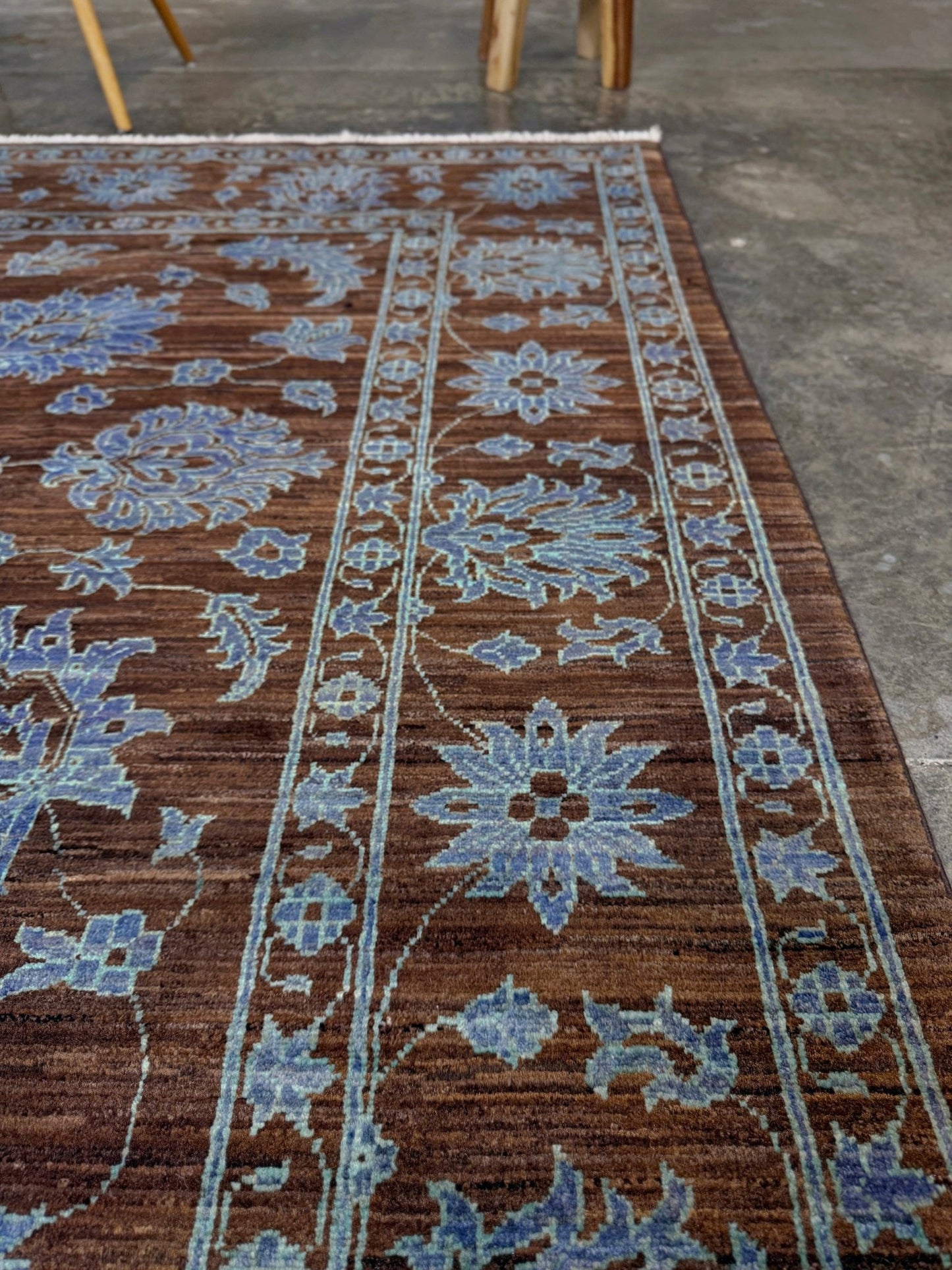 Brand new handmade floral rug with walnut brown, blue and soft turquoise accents, wool area rug 7x9 from Indigo Rugs Burlingame Bay Area.