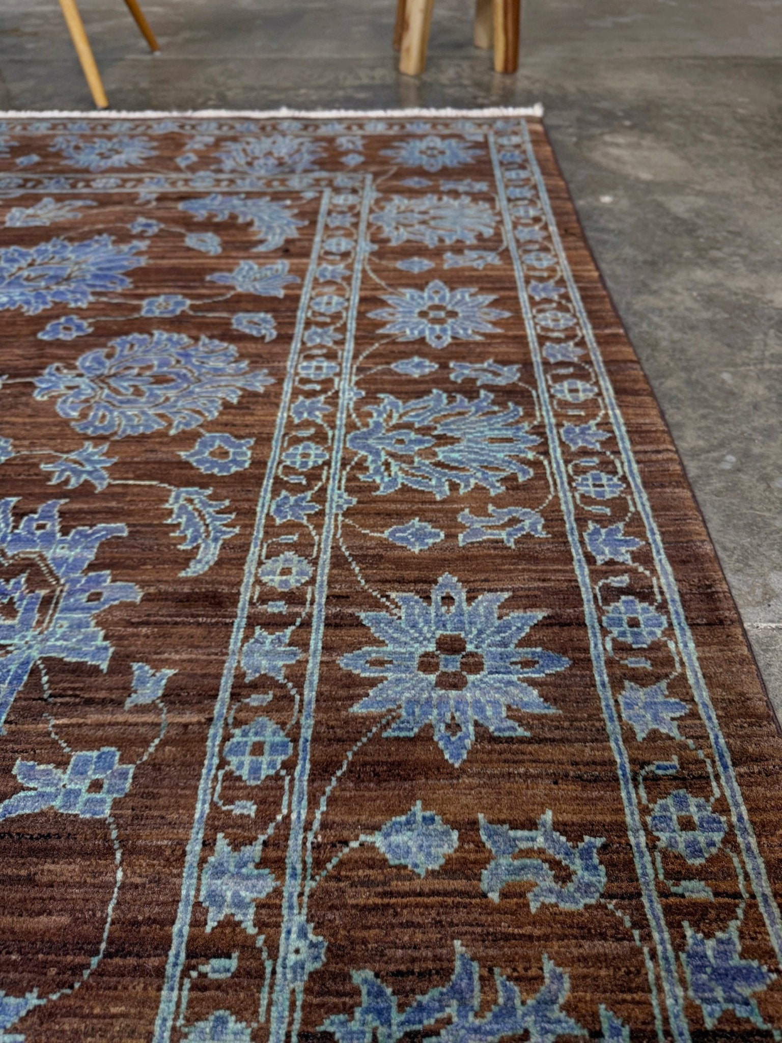Brand new handmade floral rug with walnut brown, blue and soft turquoise accents, wool area rug 7x9 from Indigo Rugs Burlingame Bay Area.