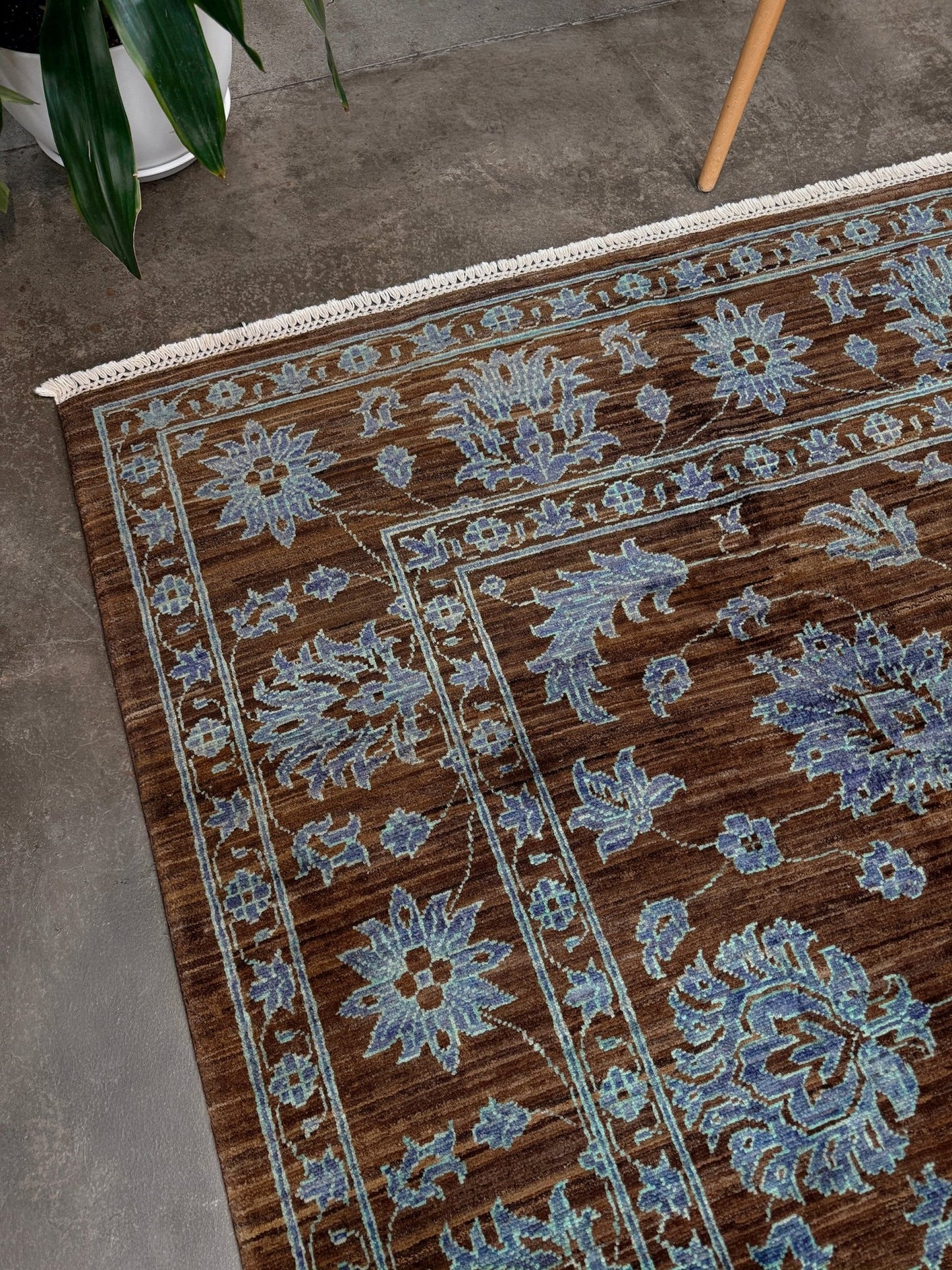 Brand new handmade floral rug with walnut brown, blue and soft turquoise accents, wool area rug 7x9 from Indigo Rugs Burlingame Bay Area.